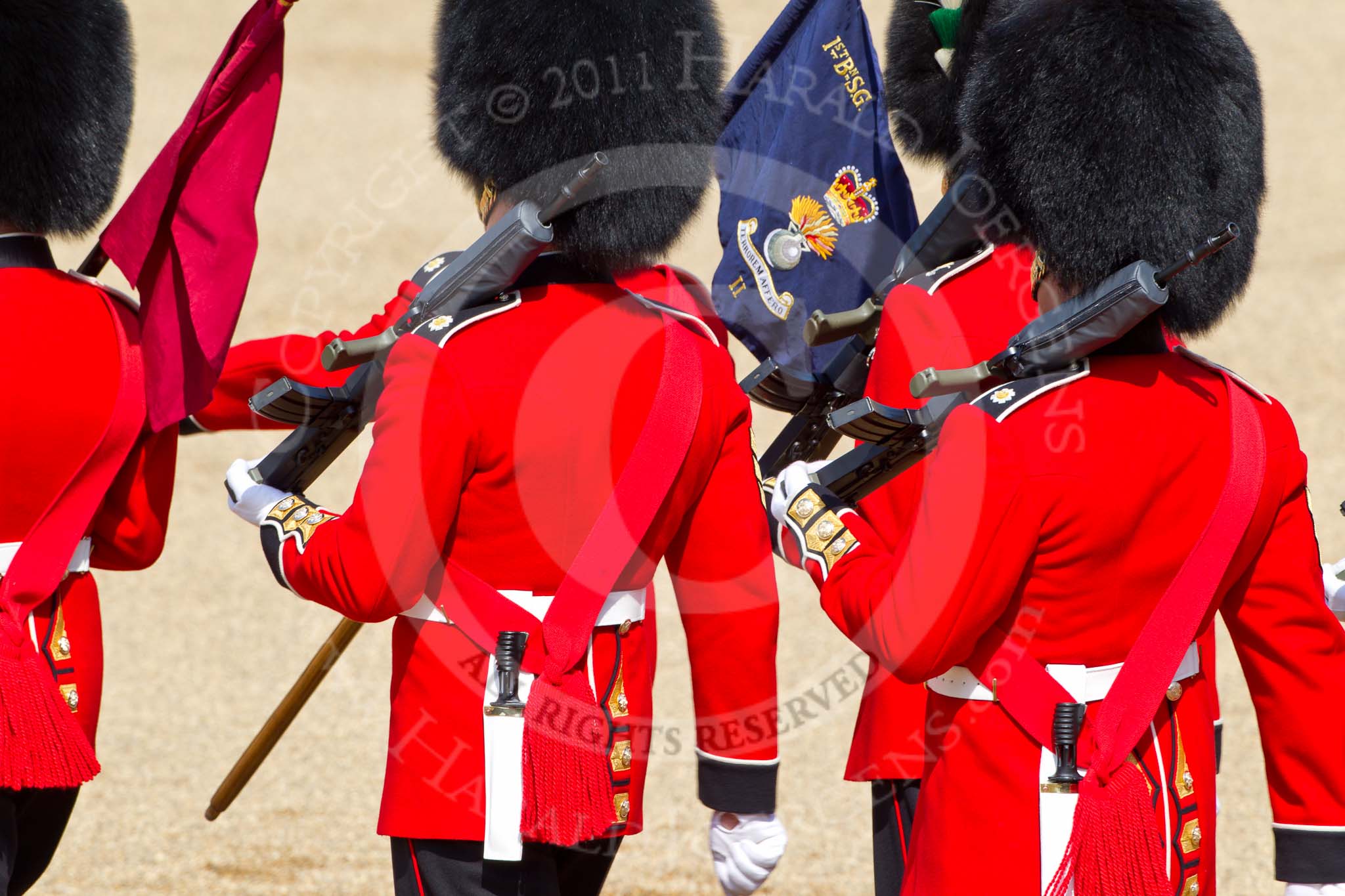 The Colonel's Review 2011: The 'Keepers of the Ground' marching back from Horse Guards Arch onto the parade ground, to mark the place for their guard. 
The blue flag, of B Company, 1st Battalion Scots Guards (No. 2 Guard on this parade), carries the motto 'Terrorem affero' - 'I carry terror with me'..
Horse Guards Parade, Westminster,
London SW1,

United Kingdom,
on 04 June 2011 at 10:16, image #14