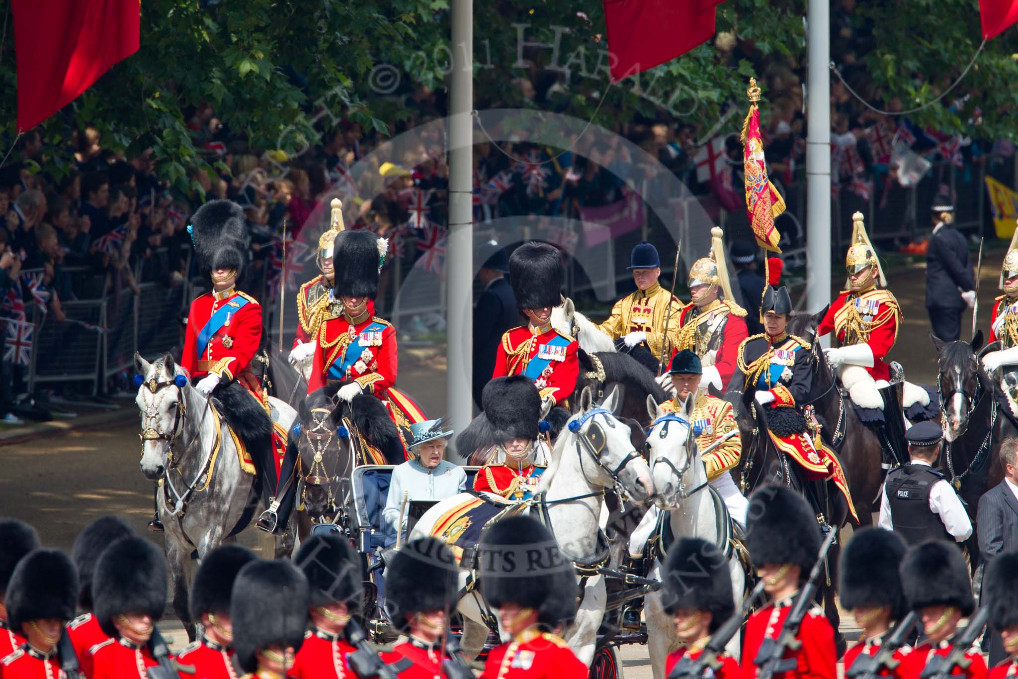 Trooping the Colour 2011: Her Majesty The Queen and HRH Prince Philip, The Duke of Edinburgh, arriving at Horse Guards Parade in the ivory mounted phaeton.
Following them are the four Royal Colonels. From the left HRH Prince William, The Duke of Cambridge, HRH Prince Charles, The Prince of Wales, HRH Prince Edward, The Duke of Kent, and HRH Princess Anne, The Princess Royal.
Behind the Prince of Wales the Field Officer of the Sovereign's Escort, Major Van Cutsem, The Life Guards.
Just behind The Princess Royal is the Escort Commander, Captain A A Wallis, The Life Guards.
These two are followed by by the Standard Party comprising of the Trumpeter, the Standard Bearer and the Standard Coverer..
Horse Guards Parade, Westminster,
London SW1,
Greater London,
United Kingdom,
on 11 June 2011 at 10:58, image #113