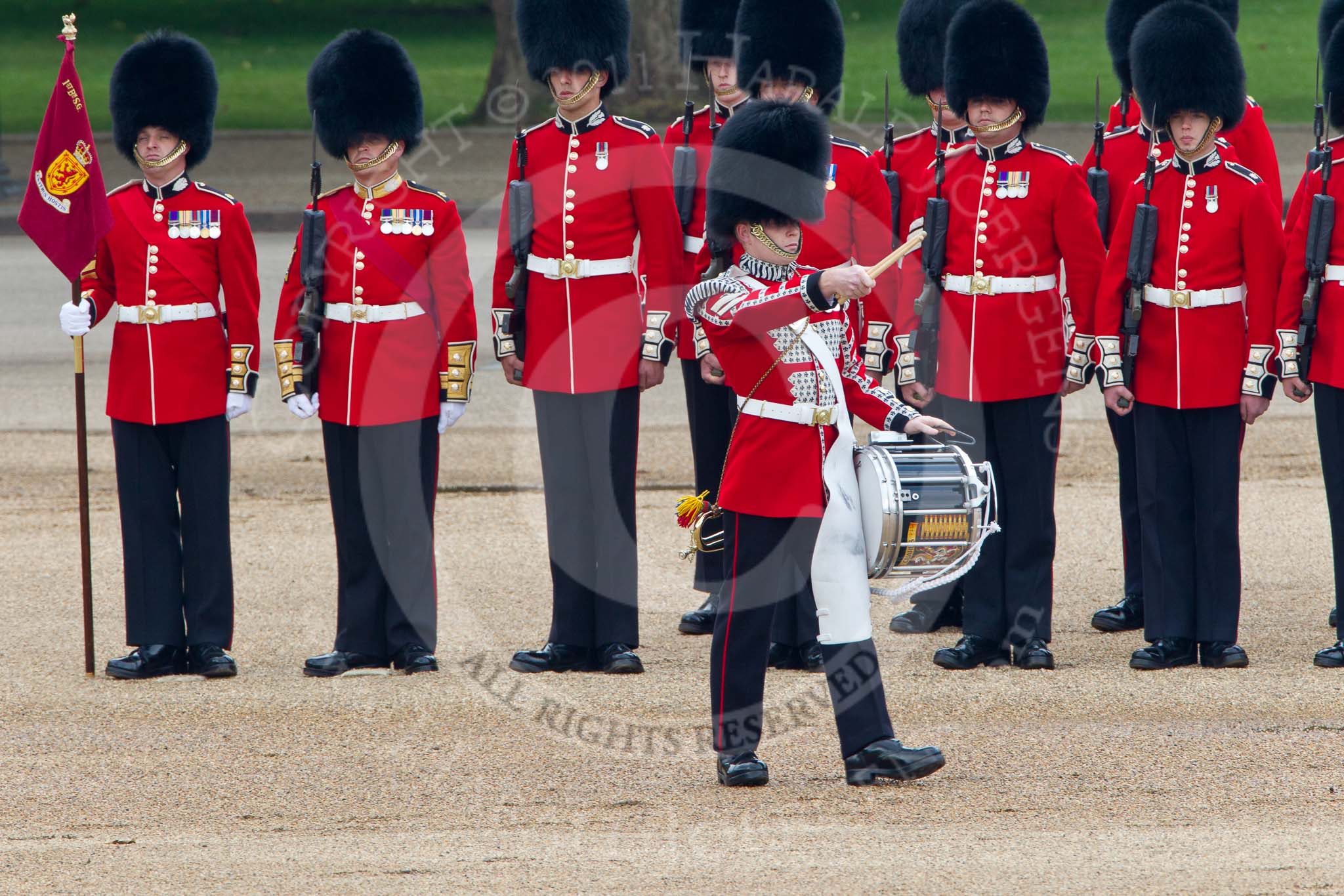 Trooping the Colour 2011: The Lone Drummer, Lance Corporal Gordon Prescott, has left the line, marching to a position at the right of the Escort to the Colour, where he will bear the 'drummers call', which will start the next phase of the parade..
Horse Guards Parade, Westminster,
London SW1,
Greater London,
United Kingdom,
on 11 June 2011 at 11:16, image #195