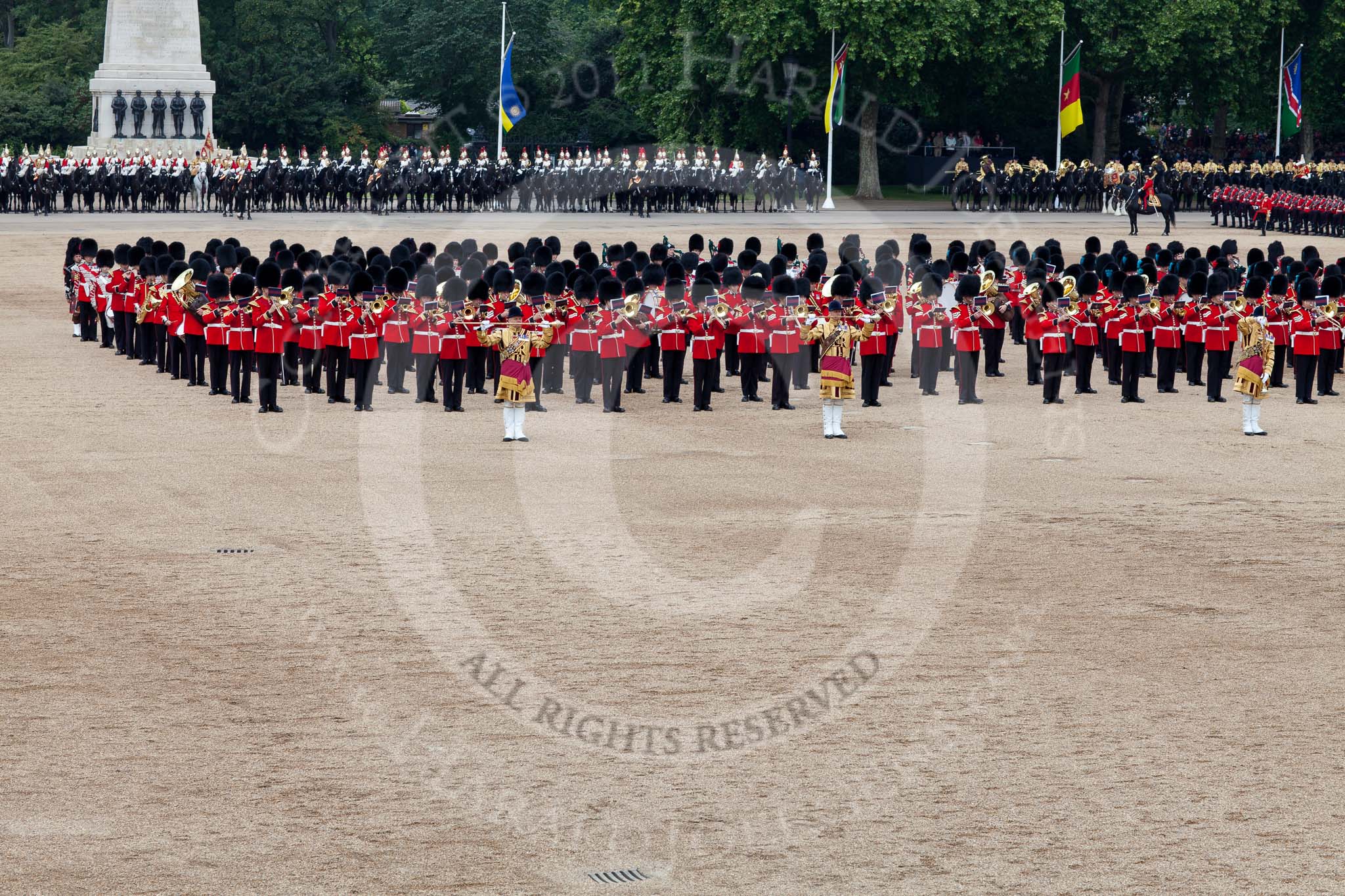 Trooping the Colour 2011: The March Past. On the left, the Massed Bands playing, marching, on the right of the photo, the guards divisions. On Top, No. 1 Guards, the Escort to the Colour, carrying the Colour.
On the backgound the Mounted Bands of the Household Divison, and on the left The Blues and Royals of the Household Cavalry..
Horse Guards Parade, Westminster,
London SW1,
Greater London,
United Kingdom,
on 11 June 2011 at 11:42, image #264