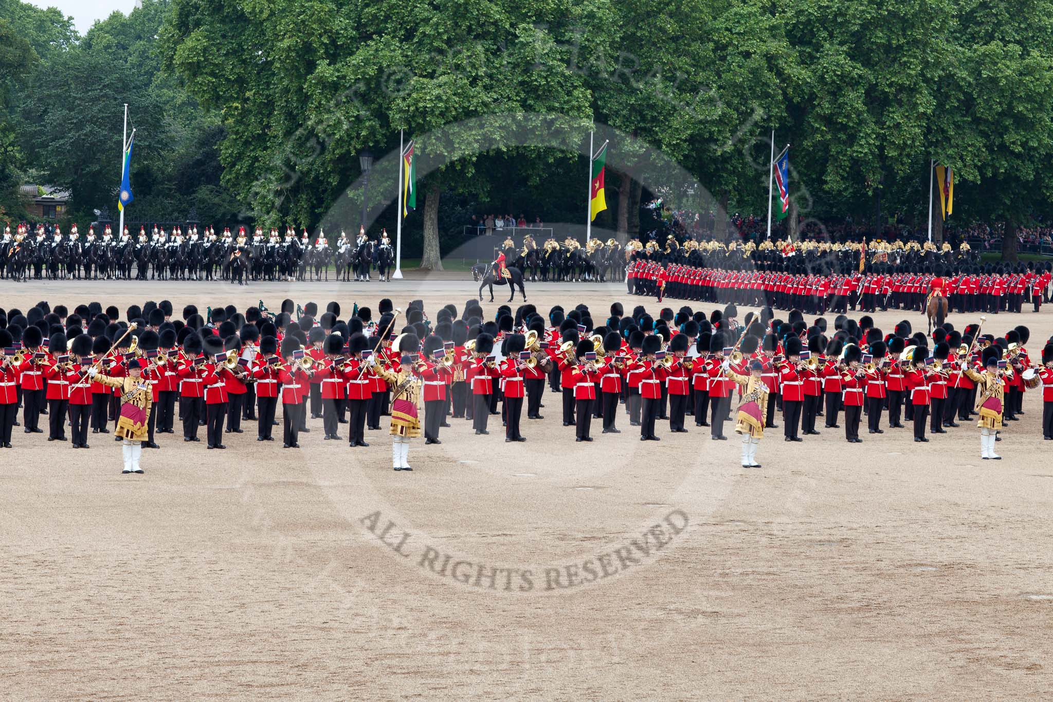 Trooping the Colour 2011: The March Past. On the left, the Massed Bands playing, marching, on the right of the photo, the guards divisions. On Top, No. 1 Guards, the Escort to the Colour, carrying the Colour.
On the backgound the Mounted Bands of the Household Divison, and on the left the Blues and Royals of The Household Cavalry..
Horse Guards Parade, Westminster,
London SW1,
Greater London,
United Kingdom,
on 11 June 2011 at 11:42, image #265