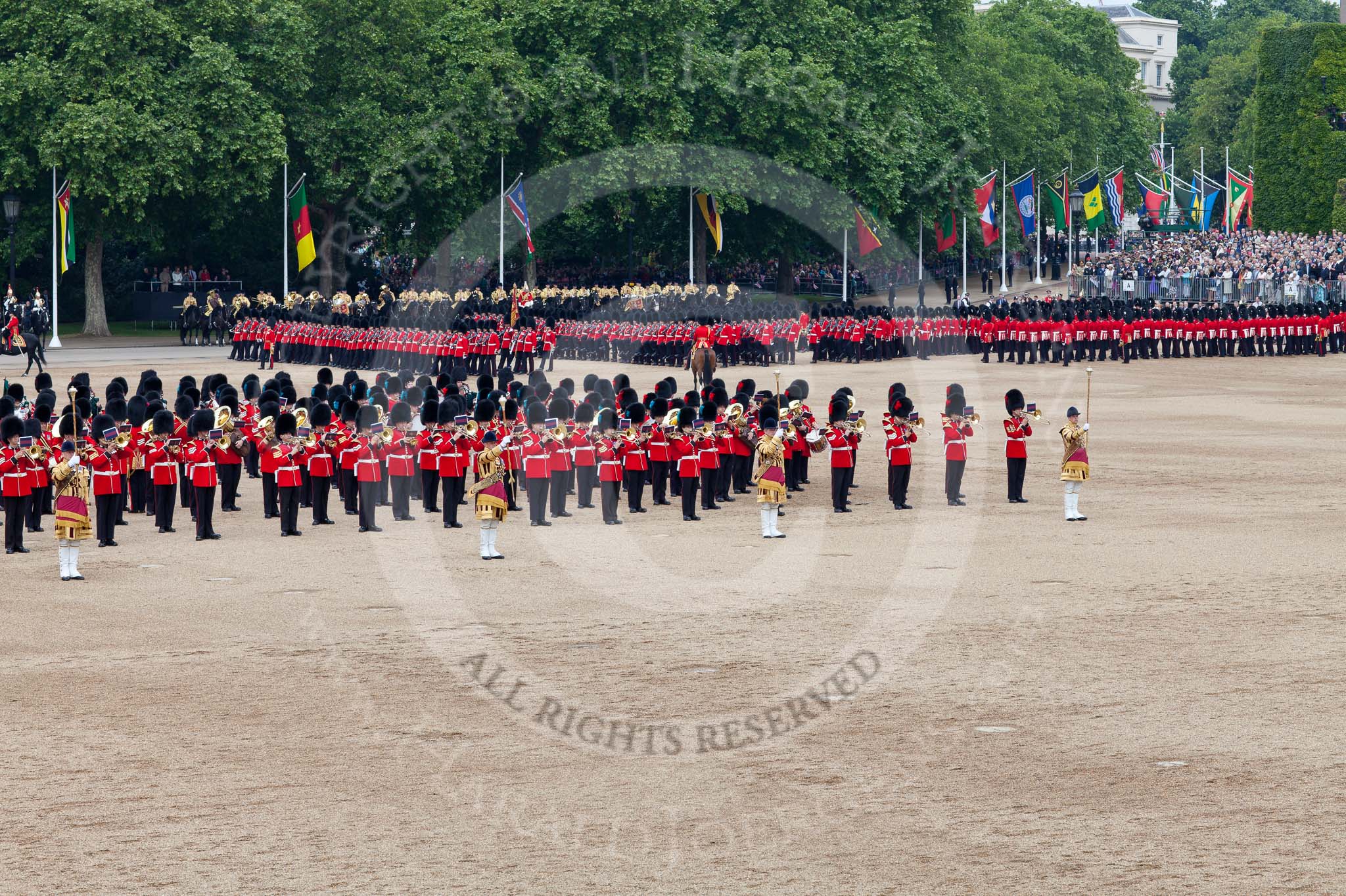 Trooping the Colour 2011: The March Past. On the left, the Massed Bands playing, marching, on the right of the photo, the guards divisions. On Top, No. 1 Guards, the Escort to the Colour, carrying the Colour.
On the backgound the Mounted Bands of the Household Divison, and on the left The Blues and Royals of the Household Cavalry..
Horse Guards Parade, Westminster,
London SW1,
Greater London,
United Kingdom,
on 11 June 2011 at 11:42, image #266