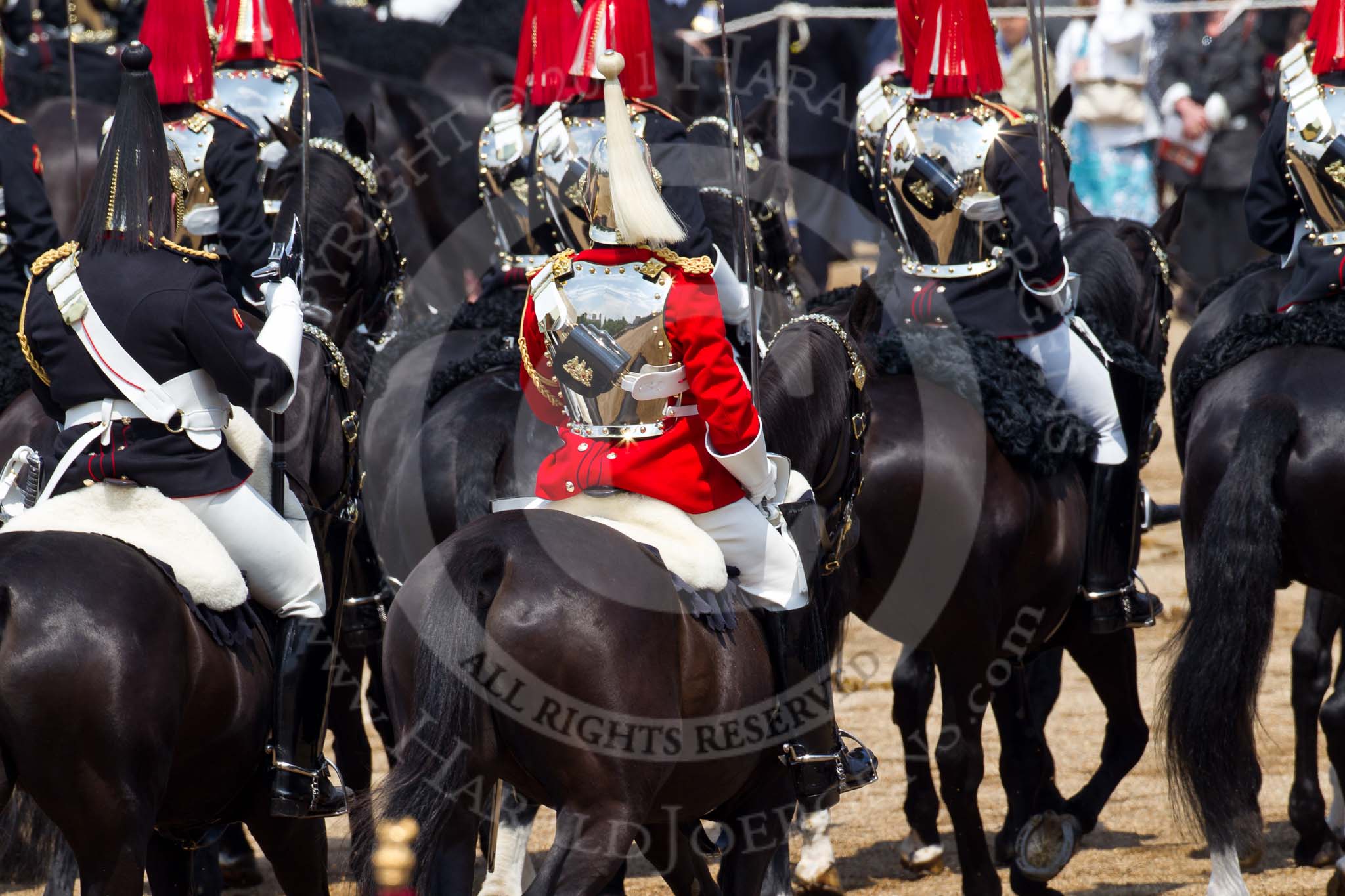 Trooping the Colour 2011: The Household Calavry marching off. On the left one of the Farriers (with the black plume and the axe), to his right, with the white plume, a trooper from The Life Guards, in front of them, with the red plumes, troopers of The Blues and Royals..
Horse Guards Parade, Westminster,
London SW1,
Greater London,
United Kingdom,
on 11 June 2011 at 11:57, image #353