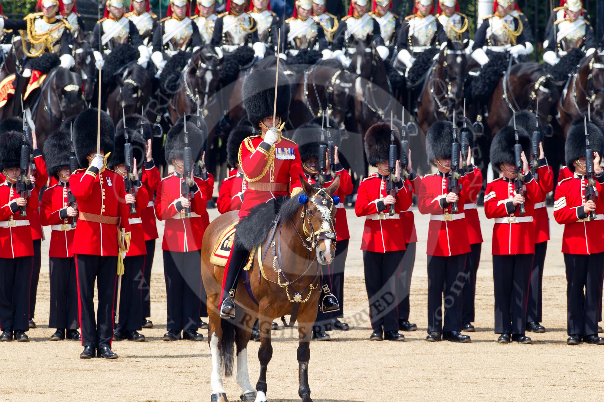 Trooping the Colour 2011: The Field Officer, Lieutenant Colonel Lincoln P M Jopp, saluting, and No. 2 Guard saluting, as they got permission by HM The Queen to march off..
Horse Guards Parade, Westminster,
London SW1,
Greater London,
United Kingdom,
on 11 June 2011 at 12:01, image #379