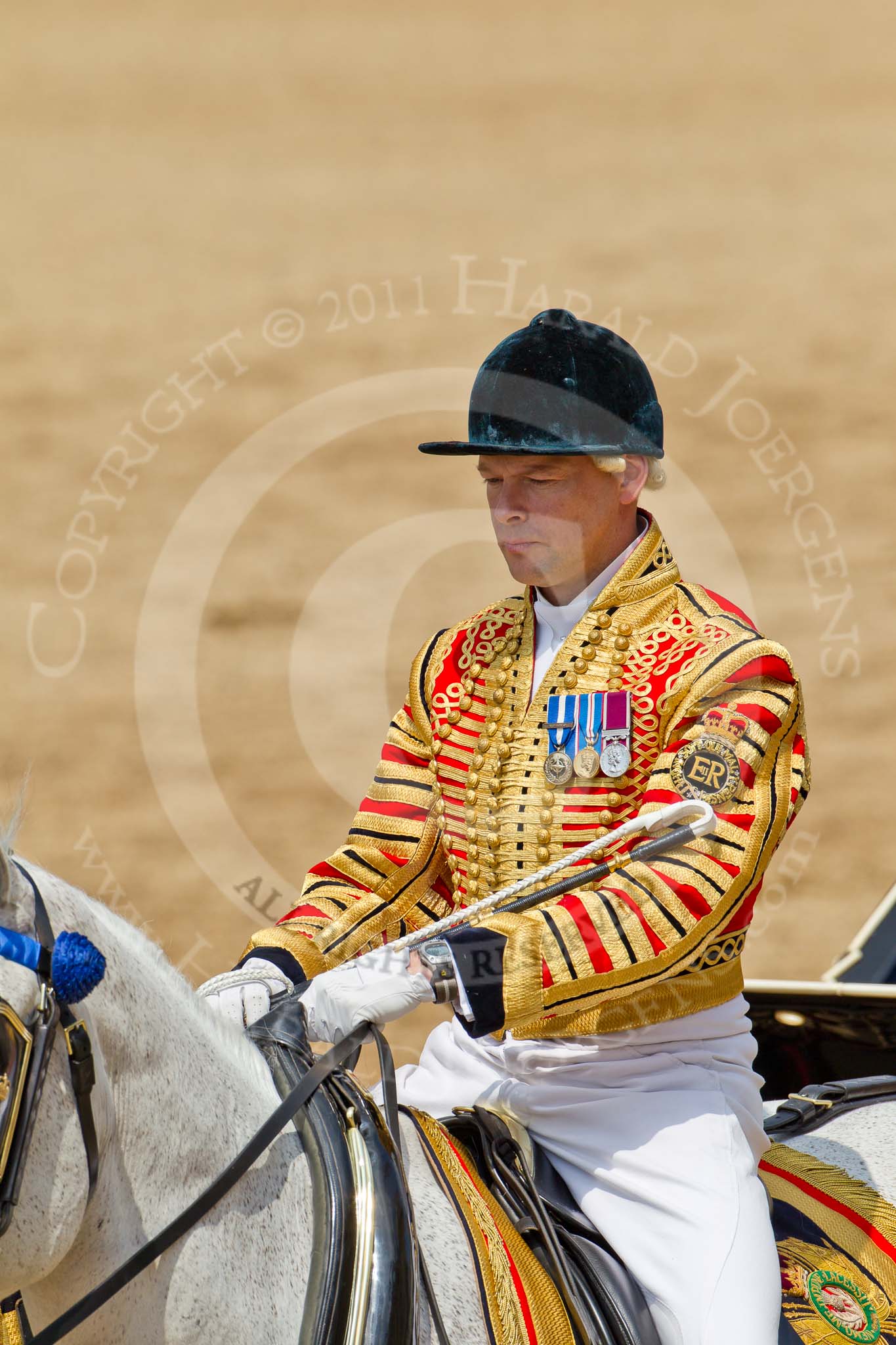 Trooping the Colour 2011: Jack Hargreaves, Head Coachman, riding one of the two Winsor Grey horses that pull the ivory mounted phaeton..
Horse Guards Parade, Westminster,
London SW1,
Greater London,
United Kingdom,
on 11 June 2011 at 12:08, image #401