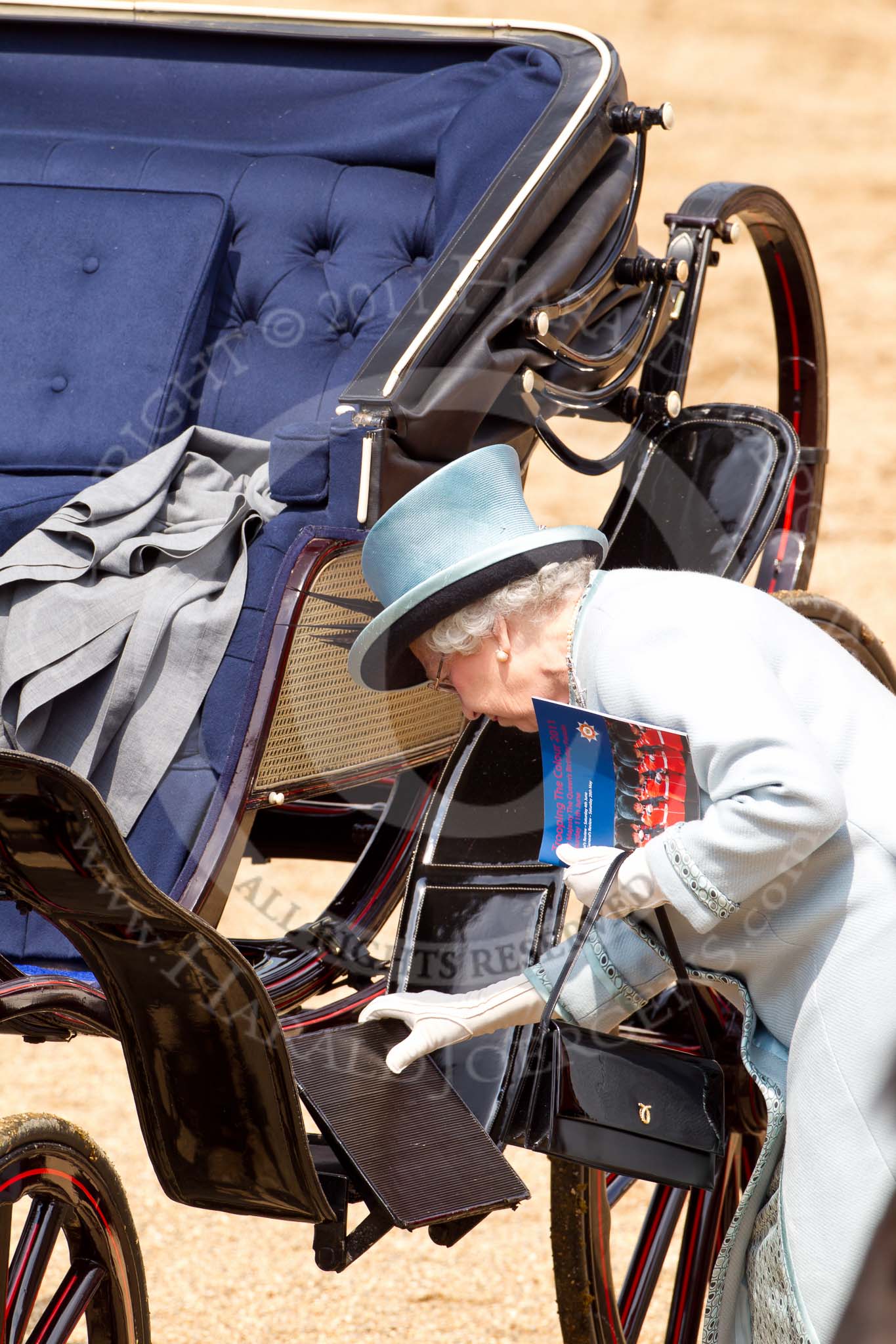 Trooping the Colour 2011: HM The Queen getting back into the ivory mounted phaeton at the end of the parade..
Horse Guards Parade, Westminster,
London SW1,
Greater London,
United Kingdom,
on 11 June 2011 at 12:08, image #403