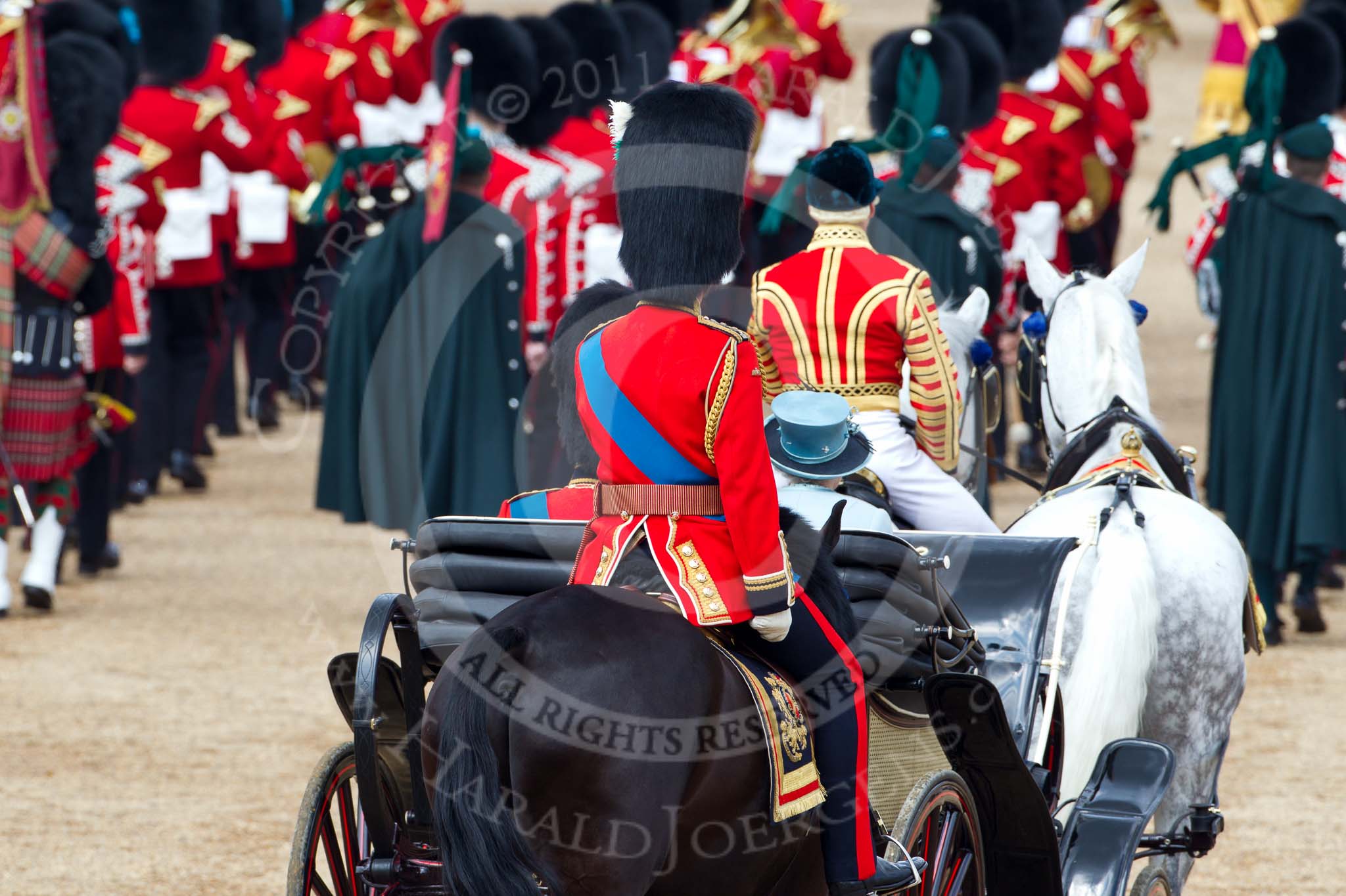 Trooping the Colour 2011: The end of the parade. The ivory mounted phaeton with HRH Prince Philip, The Duke of Edinburgh, and HM The Queen, followed by HRH Prince Charles, The Prince of Wales, leaving Horse Guards Parade on their way to Buckingham Palace via The Mall..
Horse Guards Parade, Westminster,
London SW1,
Greater London,
United Kingdom,
on 11 June 2011 at 12:10, image #417