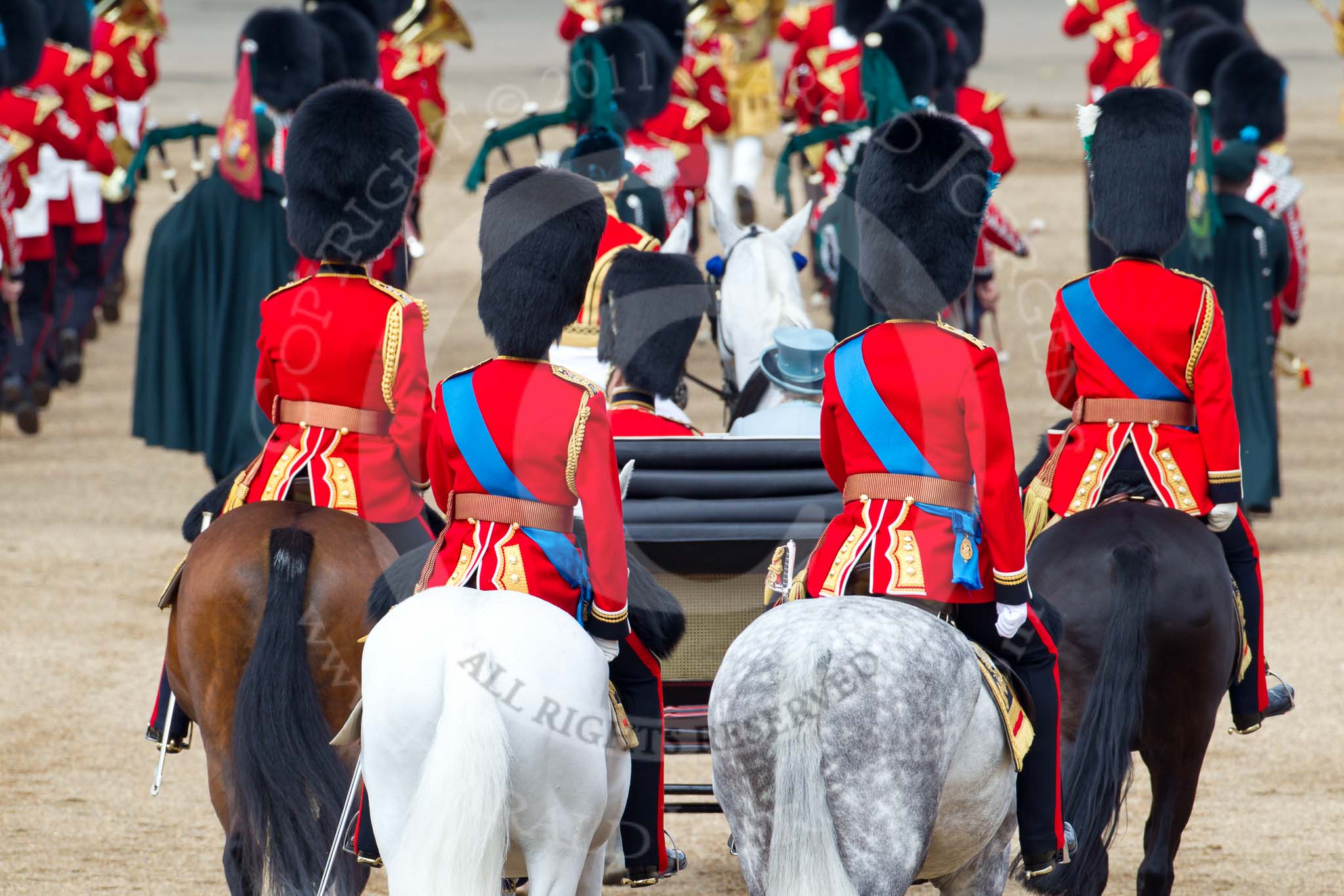 Trooping the Colour 2011: March off, the Massed Bands leaving the parade ground, followed by the Royal Procession. Behind the ivory mounted phaeton, on the left Brigade Major Household Division Lincoln Speed, Scots Guards, on his right HRH Prince Edward, the Duke of Kent, Colonel Scots Guards, and next to him HRH Prince William, The Duke of Cambridge, Colonel Irish Guards. On the right HRH Prince Charles, The Prince of Wales, Colonel Welsh Guards..
Horse Guards Parade, Westminster,
London SW1,
Greater London,
United Kingdom,
on 11 June 2011 at 12:10, image #419