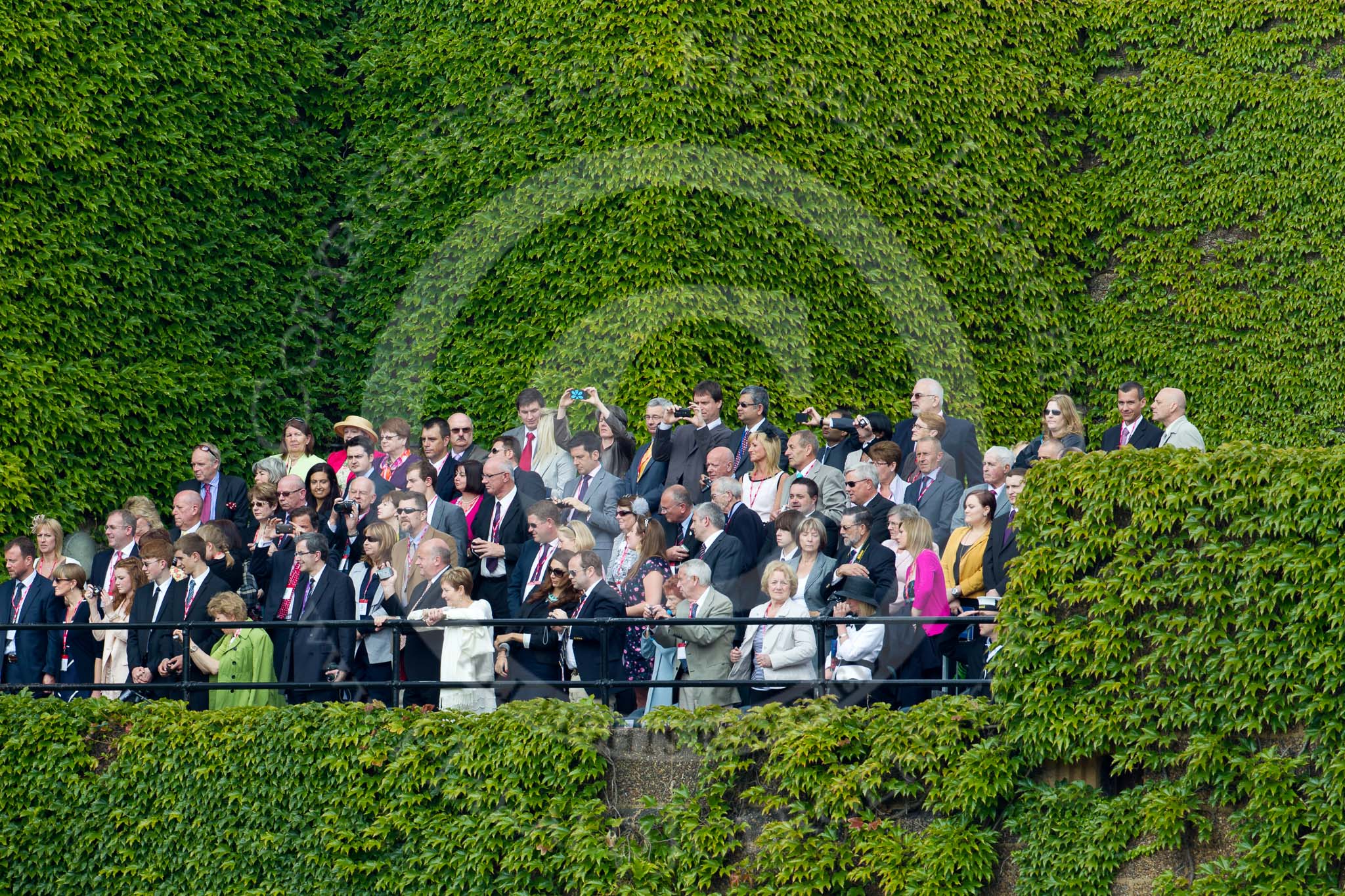 Trooping the Colour 2011: Spectators watching 'Trooping the Colour' from the Citadel, the ivy-covered wartime bunker that is part of the Old Admirality Building in Whitehall, facing Horse Guards Parade..
Horse Guards Parade, Westminster,
London SW1,
Greater London,
United Kingdom,
on 11 June 2011 at 12:11, image #426