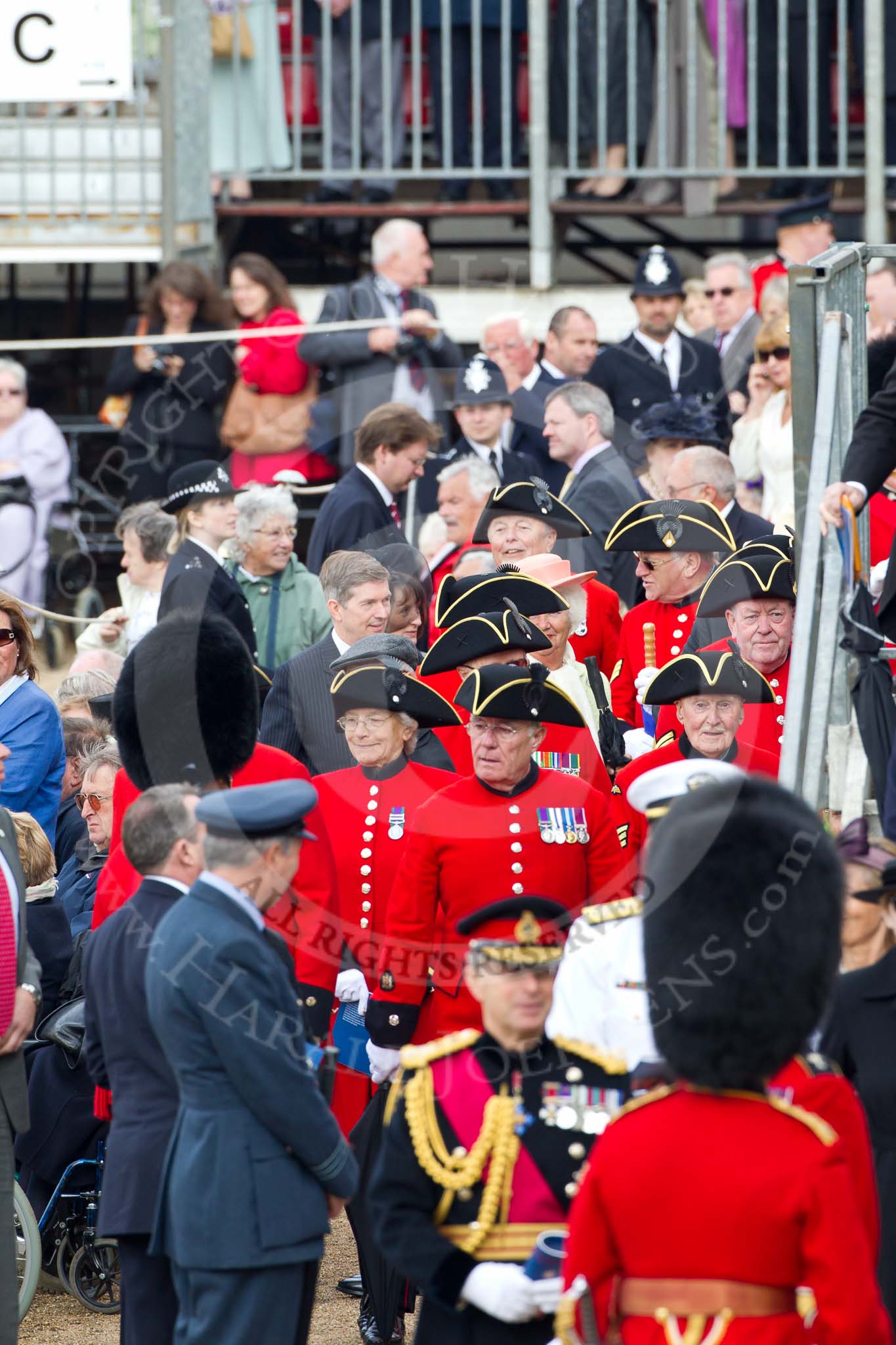 Trooping the Colour 2011: Chelsea Pensioners' (ex-servicemen and -women, in-pensioners living at the Royal Hospital Chelsea), in their scarlet coats and wearing their tricone hats, about to leave at the end of the parade..
Horse Guards Parade, Westminster,
London SW1,
Greater London,
United Kingdom,
on 11 June 2011 at 12:14, image #441