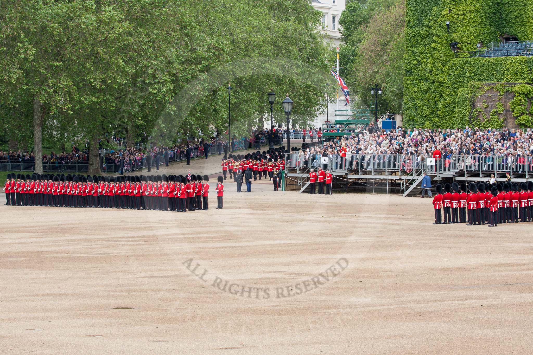 The Colonel's Review 2012: No. 6 guard and No. 5 guard in place at Horse Guards Parade, the Band of the Coldstream Guards just arriving from the Mall..
Horse Guards Parade, Westminster,
London SW1,

United Kingdom,
on 09 June 2012 at 10:28, image #69