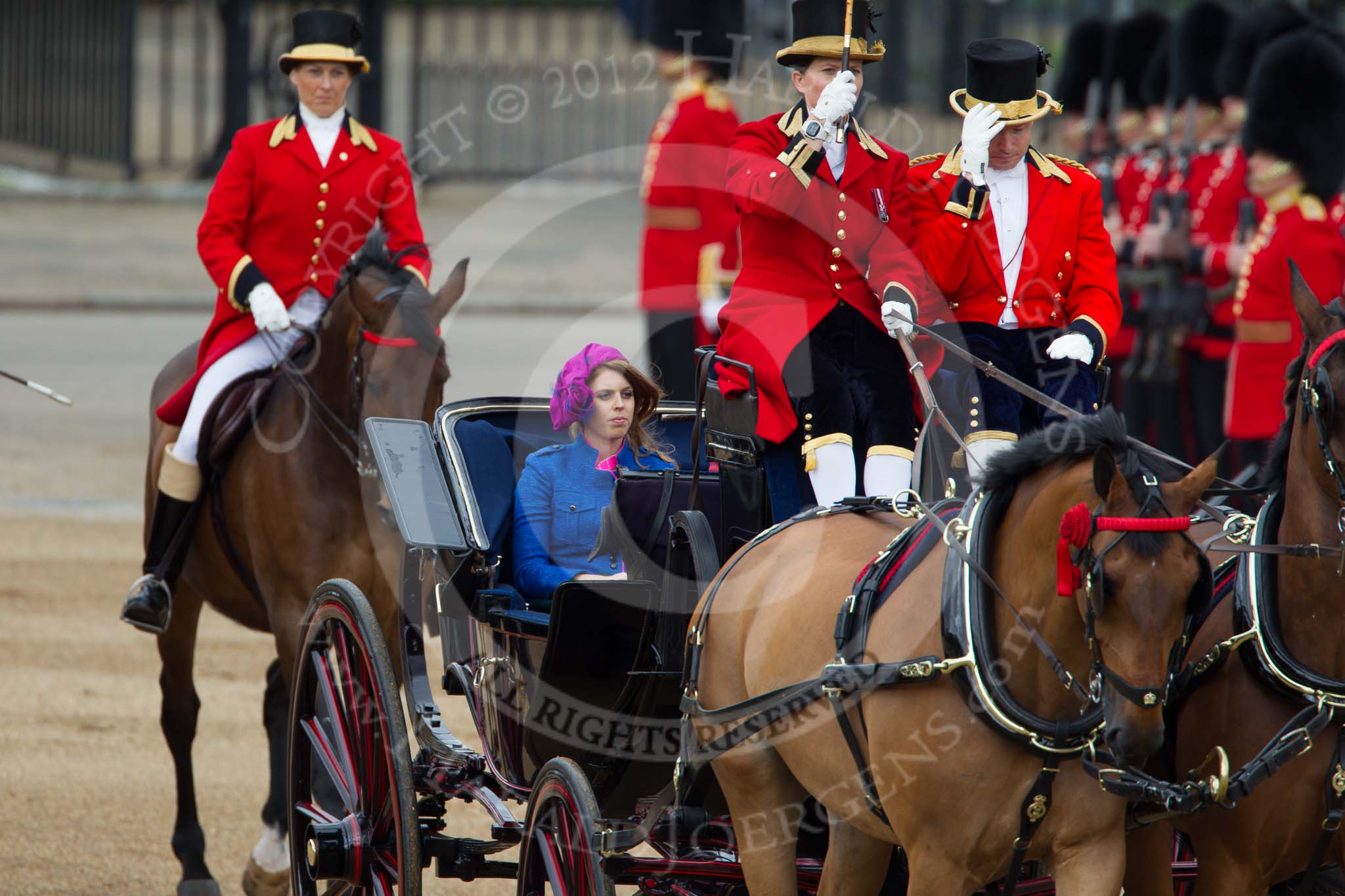 Trooping the Colour 2012: Princess Beatrice of York in the second carriage, with Lady Coachman Phillipa Jackson saluting the Colour..
Horse Guards Parade, Westminster,
London SW1,

United Kingdom,
on 16 June 2012 at 10:50, image #122