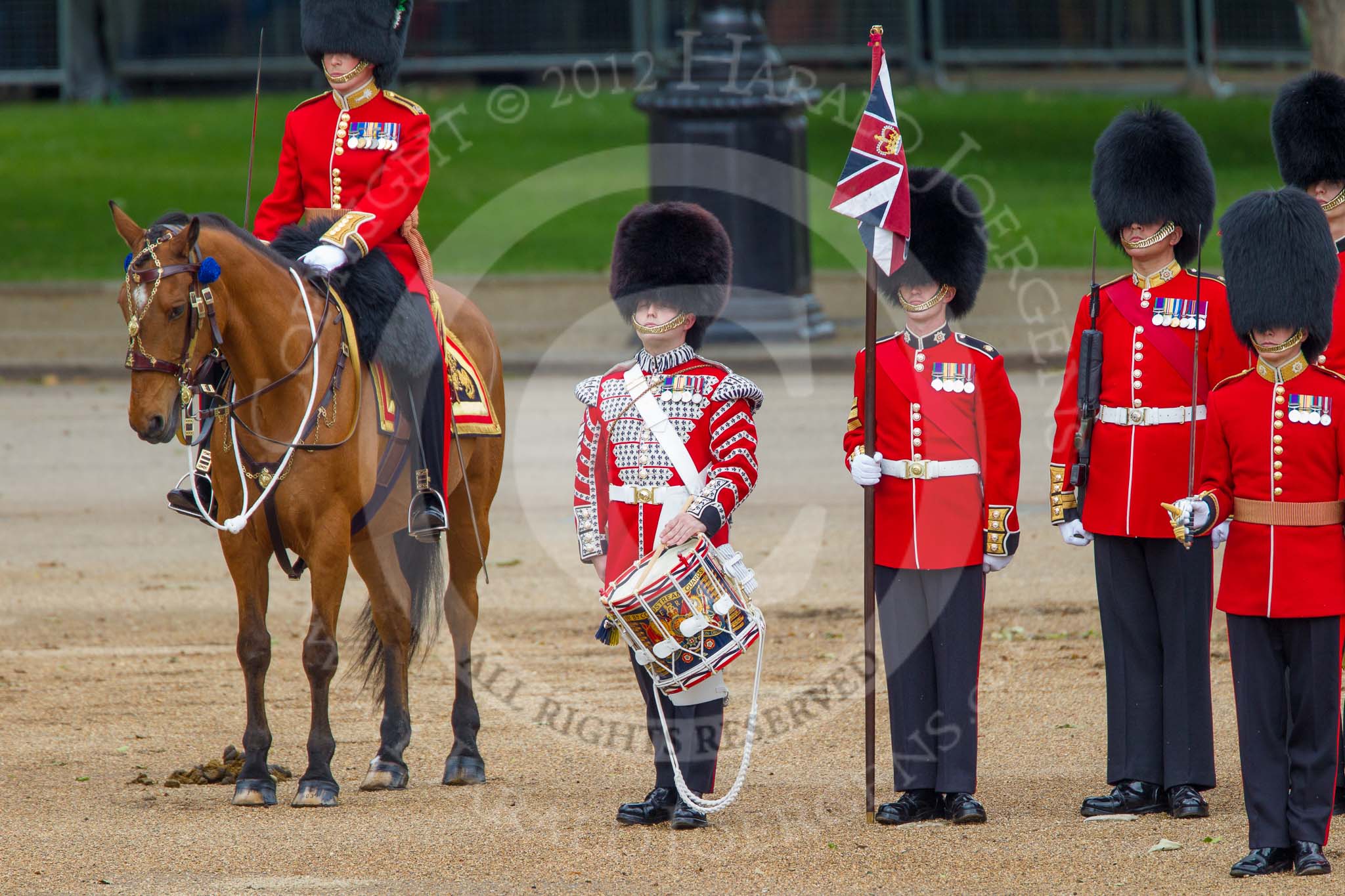 Trooping the Colour 2012: The Lone Drummer, Lance Sergeant Paul Blako, ready to play the Drummers Call. Next to him, on horseback, the Major of the Parade, Major Mark Lewis, Welsh Guards..
Horse Guards Parade, Westminster,
London SW1,

United Kingdom,
on 16 June 2012 at 11:15, image #288