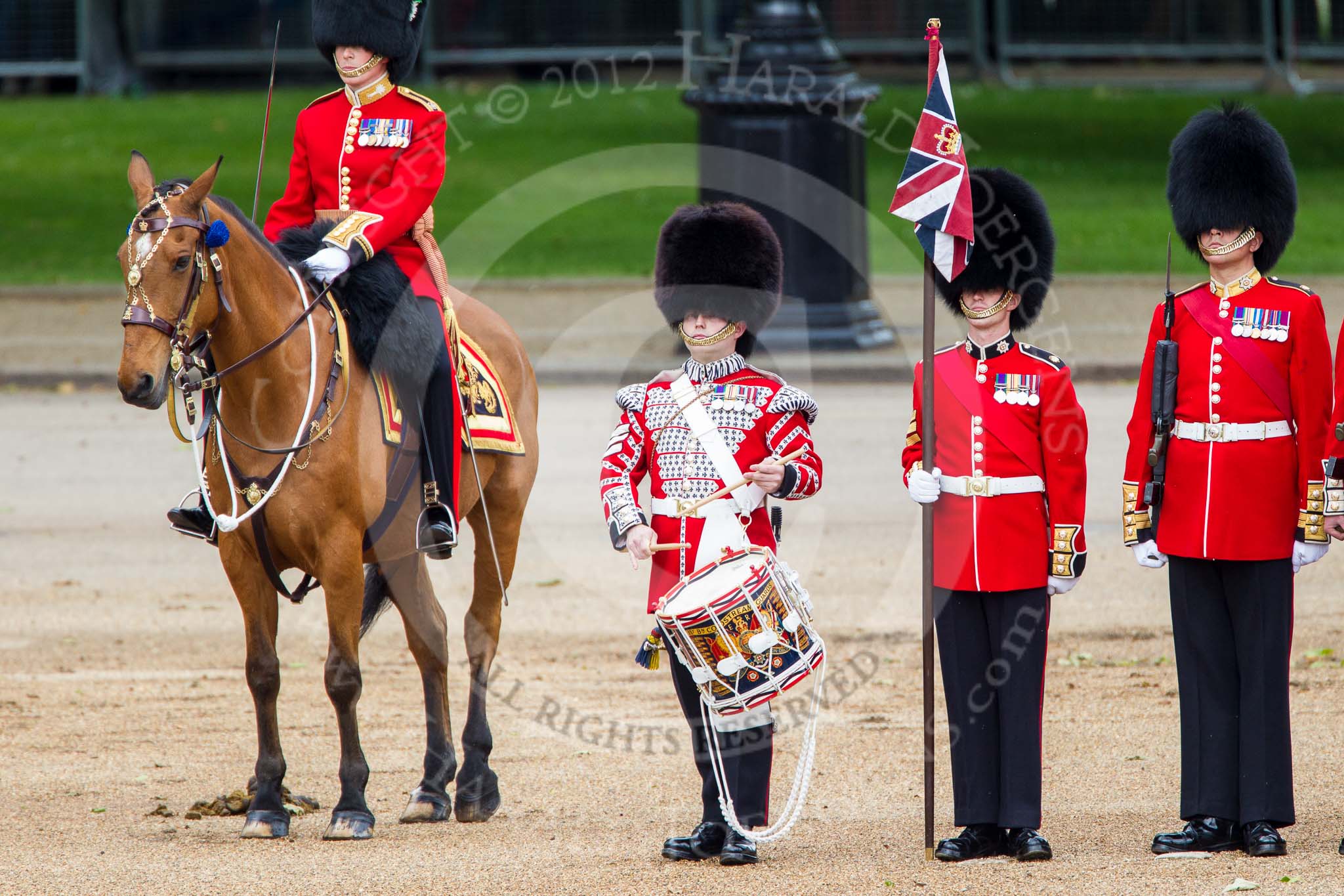 Trooping the Colour 2012: The Lone Drummer, Lance Sergeant Paul Blako, playing the  Drummers Call. Next to him, on horseback, the Major of the Parade, Major Mark Lewis, Welsh Guards..
Horse Guards Parade, Westminster,
London SW1,

United Kingdom,
on 16 June 2012 at 11:16, image #289