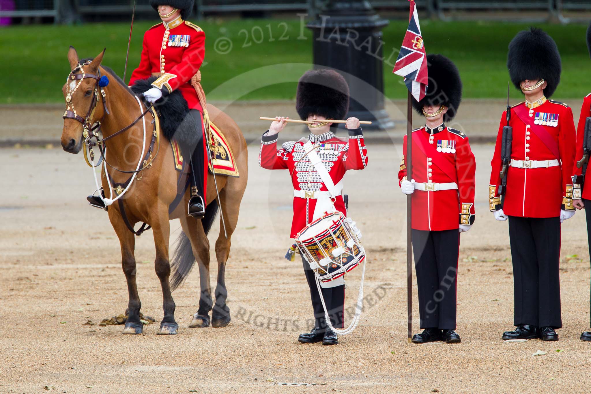 Trooping the Colour 2012: The Lone Drummer, Lance Sergeant Paul Blako, saluting, before he starts marching towards the Colour..
Horse Guards Parade, Westminster,
London SW1,

United Kingdom,
on 16 June 2012 at 11:16, image #290