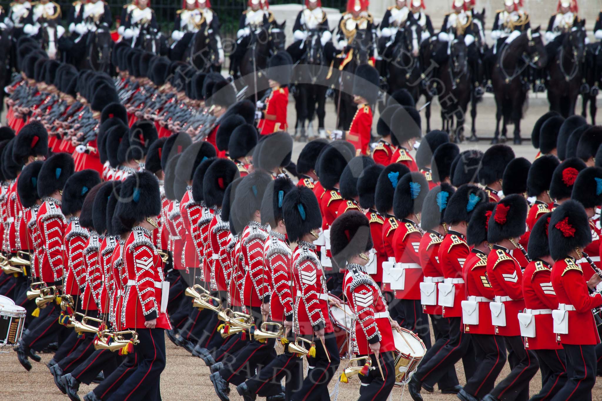 Trooping the Colour 2012: The Massed bands during the March Past. The bands are marching to the right, and the guards divisions, between the bands and the cavalry in this image, are marching to the left, surrounding Horse Guards Parade anti-clockwise..
Horse Guards Parade, Westminster,
London SW1,

United Kingdom,
on 16 June 2012 at 11:33, image #384