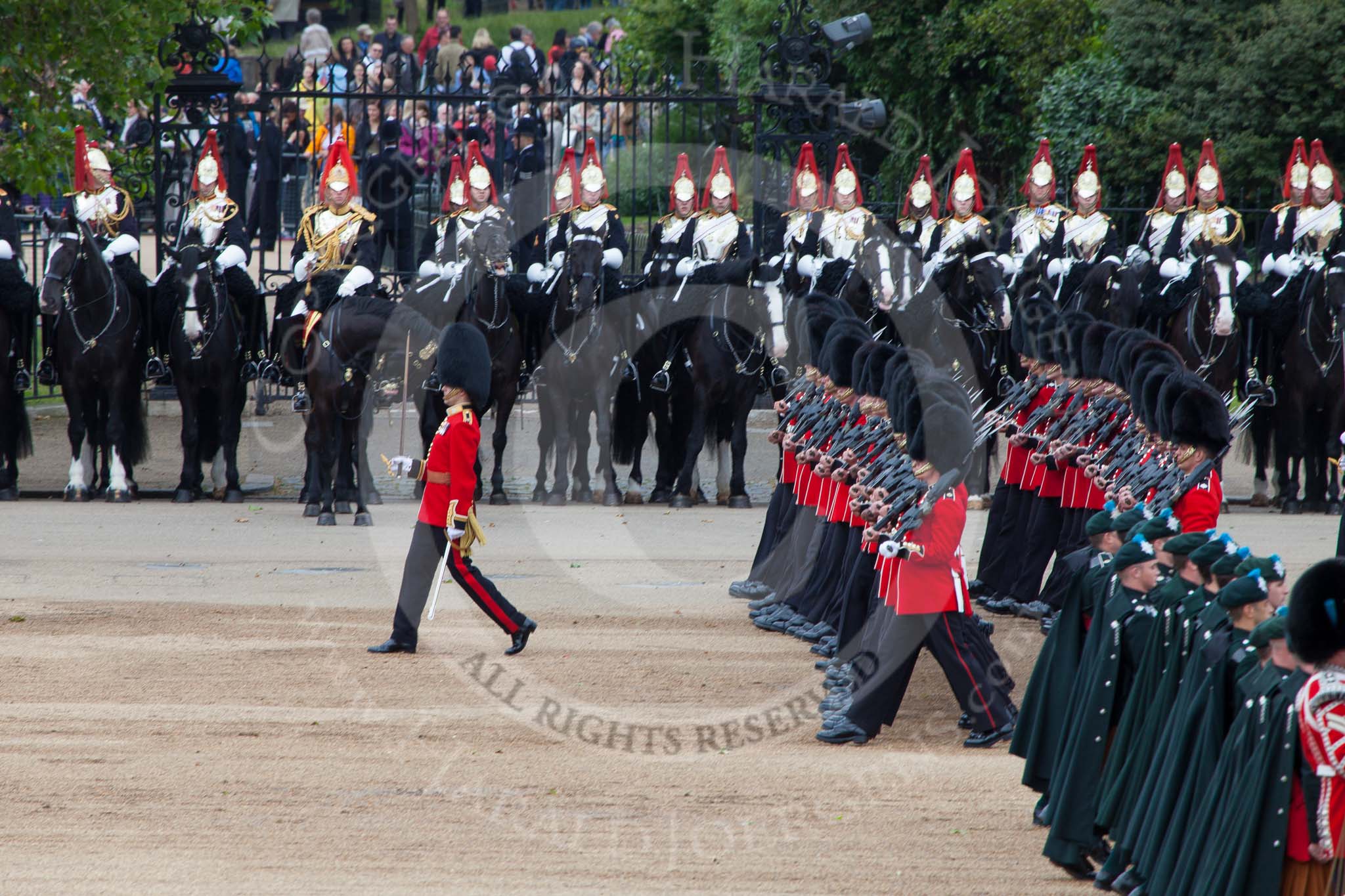 Trooping the Colour 2012: The Massed bands during the March Past. No. 5 Guard, 1st Battalion Irish Guards, marching to the left, with Irish Guards musicians (here the drummers and pipers) marching, as part os the Massed Bands, to the right..
Horse Guards Parade, Westminster,
London SW1,

United Kingdom,
on 16 June 2012 at 11:33, image #386