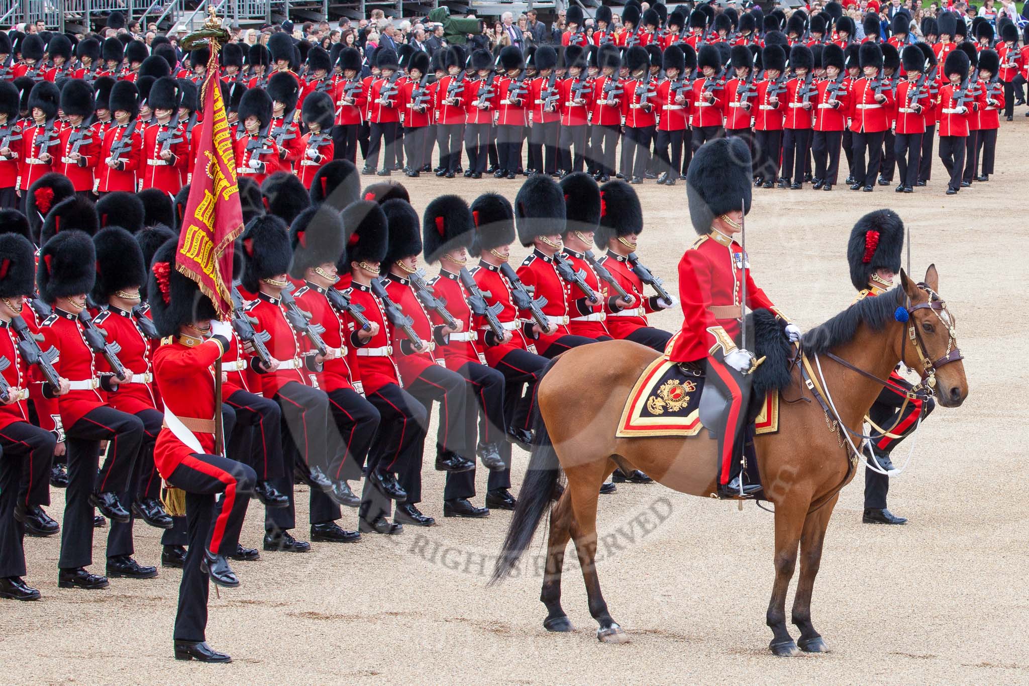 Trooping the Colour 2012: About to march past Her Majesty - the Major of the Parade, Major Mark Lewis, Welsh Guards, the Ensign, Second Lieutenant Hugo Codrington, carrying the Colour, and the guards divisions..
Horse Guards Parade, Westminster,
London SW1,

United Kingdom,
on 16 June 2012 at 11:35, image #410