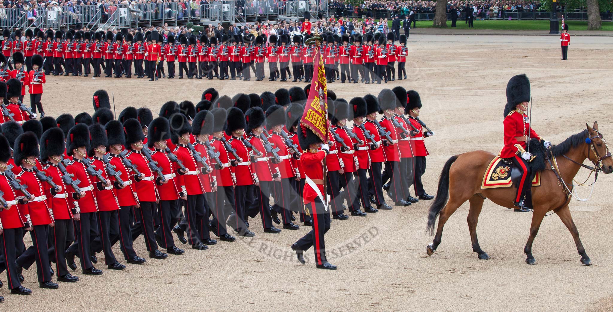 Trooping the Colour 2012: About to march past Her Majesty - the Major of the Parade, Major Mark Lewis, Welsh Guards, the Ensign, Second Lieutenant Hugo Codrington, carrying the Colour, and the guards divisions..
Horse Guards Parade, Westminster,
London SW1,

United Kingdom,
on 16 June 2012 at 11:36, image #412