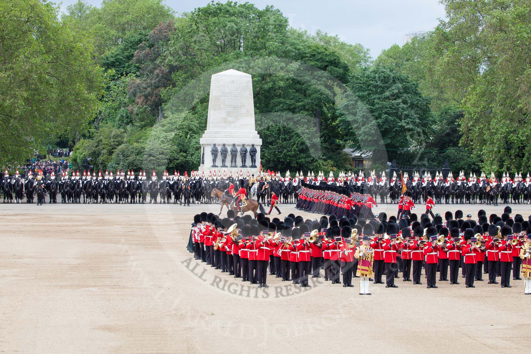 Trooping the Colour 2012: The March Past: No. 1 Guard (Escort to the Colour), 1st Battalion Coldstream Guards, marching between the Household Cavalry on the St.  James's Park side of Horse Guards Parade, and the Massed Bands in the cenre. Riding in front is the Major of the Parade and the Field Officer..
Horse Guards Parade, Westminster,
London SW1,

United Kingdom,
on 16 June 2012 at 11:42, image #468