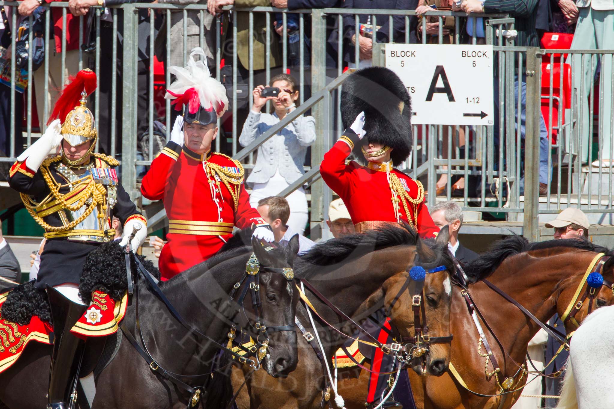 The Colonel's Review 2013: From left to right - Silver-Stick-in-Waiting, Colonel S H Cowen, The Blues and Royals, 
Chief of Staff, Colonel R H W St G Bodington, Welsh Guards, and Aide-de-Camp, Captain J J Hathaway-White, Grenadier Guards, saluting the Colour..
Horse Guards Parade, Westminster,
London SW1,

United Kingdom,
on 08 June 2013 at 11:00, image #286