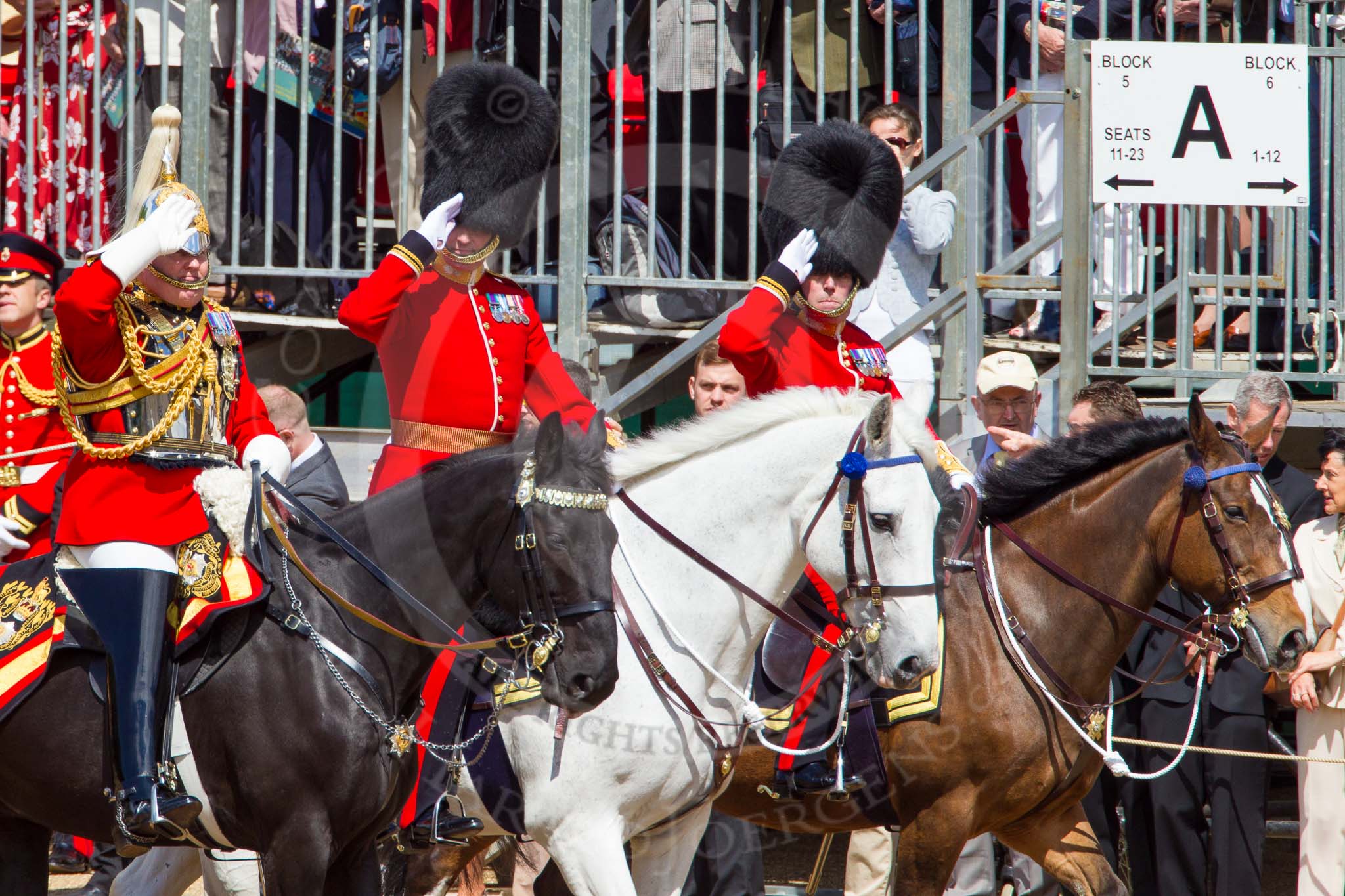 The Colonel's Review 2013: The Silver Stick Adjutant and Foot Guards Regimental Adjutants - Lieutenant Colonel H S J Scott, The Life Guards, Major G V A Baker. Grenadier Guards, and Lieutenant Colonel A W Foster, Scots Guards, saluting the Colour..
Horse Guards Parade, Westminster,
London SW1,

United Kingdom,
on 08 June 2013 at 11:00, image #288