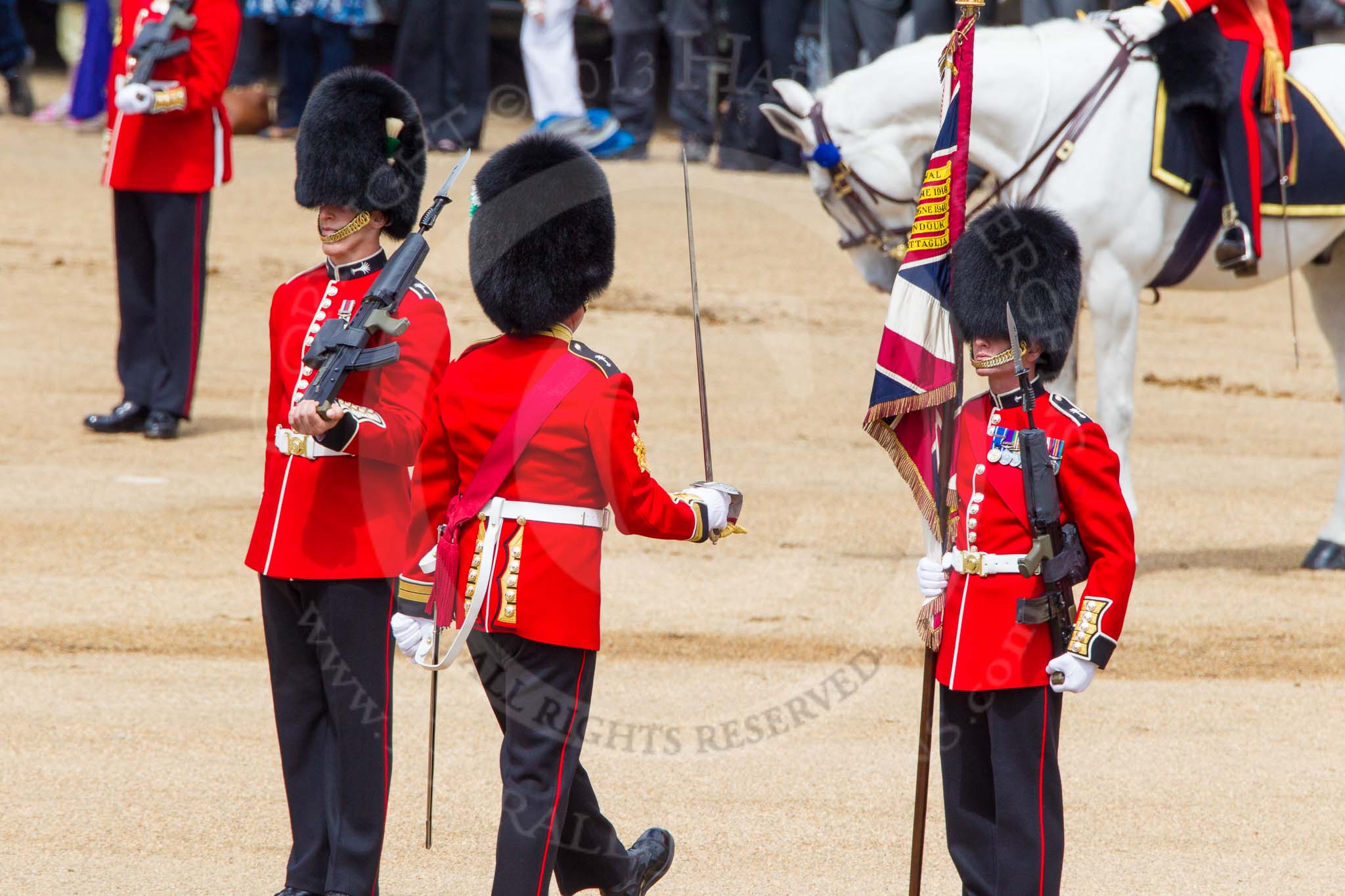 The Colonel's Review 2013: No. 1 Guard the Regimental Sergeant Major, WO1 Martin Topps, Welsh Guards marches forward followed by the Ensign, approches the Colour Party..
Horse Guards Parade, Westminster,
London SW1,

United Kingdom,
on 08 June 2013 at 11:19, image #499