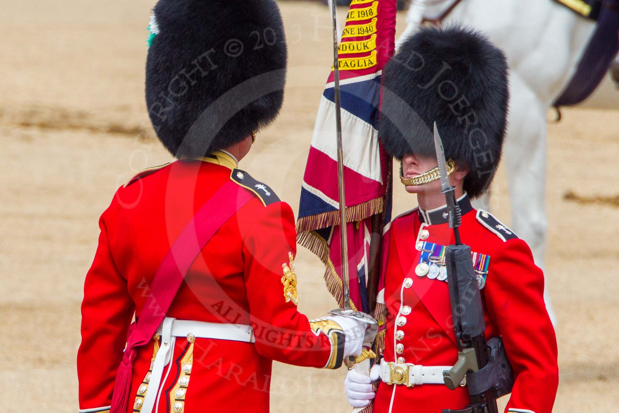 The Colonel's Review 2013: No. 1 Guard the Regimental Sergeant Major, WO1 Martin Topps, Welsh Guards saluting the Colour with his sword..
Horse Guards Parade, Westminster,
London SW1,

United Kingdom,
on 08 June 2013 at 11:19, image #503