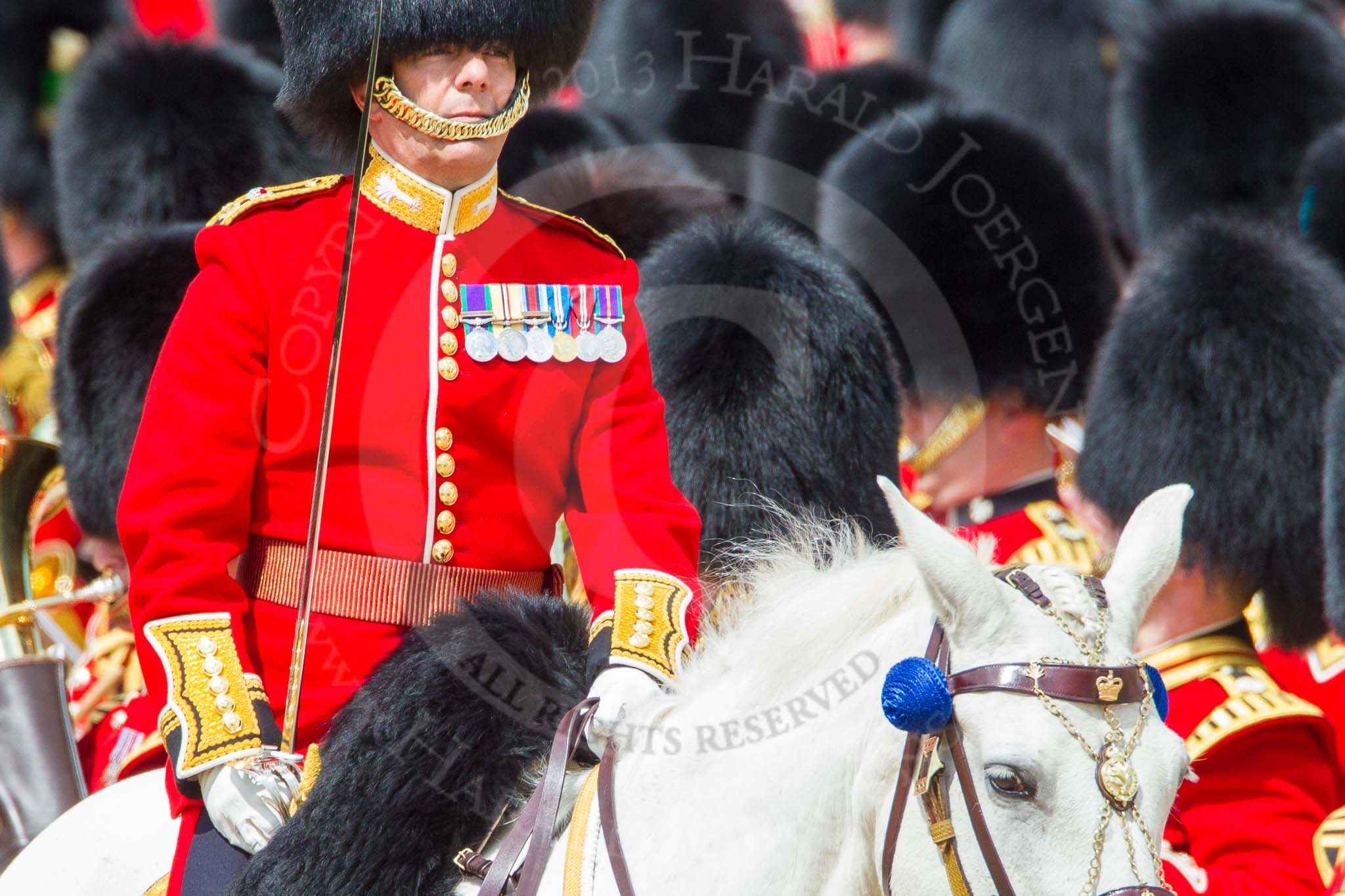 The Colonel's Review 2013: The Field Officer in Brigade Waiting, Lieutenant Colonel Dino Bossi, Welsh Guards, commanding "present arms" as the Escort to the Colour is starting the trooping of the Colour through the ranks..
Horse Guards Parade, Westminster,
London SW1,

United Kingdom,
on 08 June 2013 at 11:23, image #552