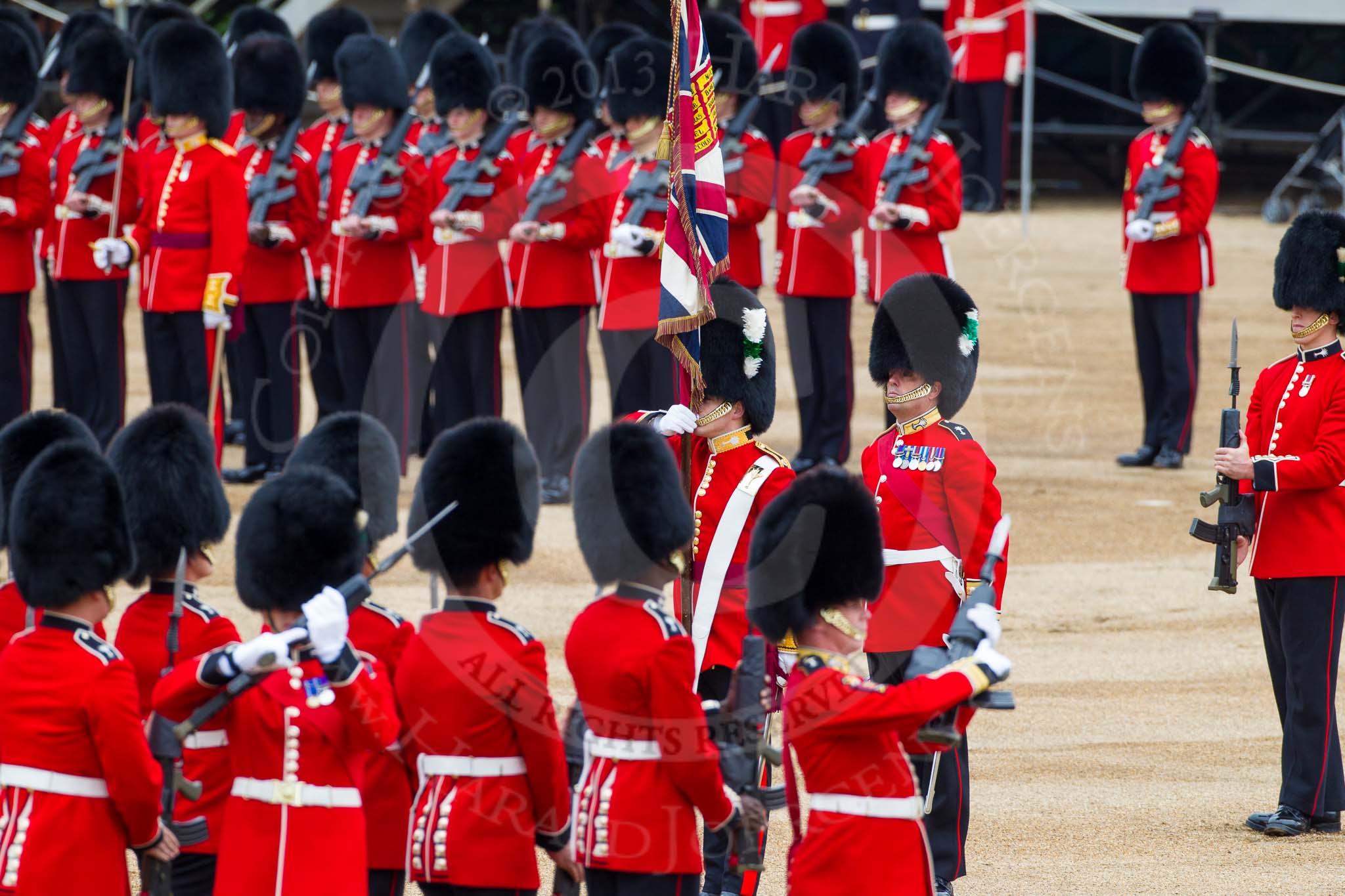 Major General's Review 2013: The Ensign, Second Lieutenant Joel Dinwiddle, in posession of the Colour, turns around to No. 1 Guard, now the Escort to the Colour..
Horse Guards Parade, Westminster,
London SW1,

United Kingdom,
on 01 June 2013 at 11:20, image #407