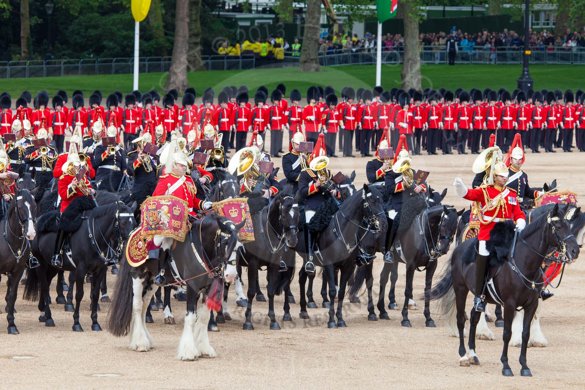 Major General's Review 2013: The Director of Music of the Household Cavalry, Major Paul Wilman, The Life Guards, during the Mounted Troops Ride Past. Behind him the kettle drummer from The Blues and Royals..
Horse Guards Parade, Westminster,
London SW1,

United Kingdom,
on 01 June 2013 at 11:51, image #587