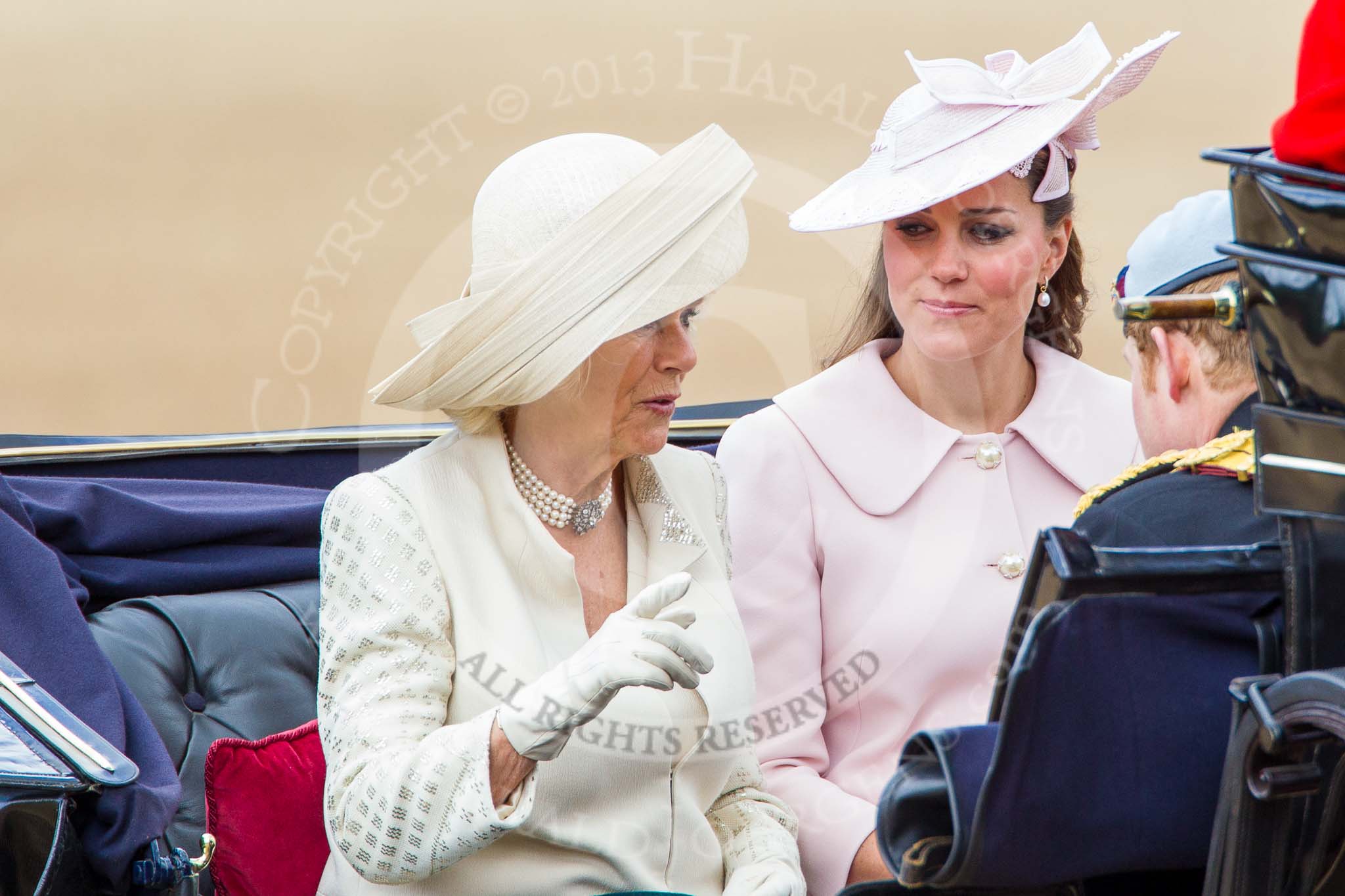 Trooping the Colour 2013: HRH The Duchess of Cornwall, HRH The Duchess of Cambridge and HRH Prince Harry of Wales in the first barouche carriage on the way across Horse Guards Parade to watch the parade from the Major General's office..
Horse Guards Parade, Westminster,
London SW1,

United Kingdom,
on 15 June 2013 at 10:50, image #204