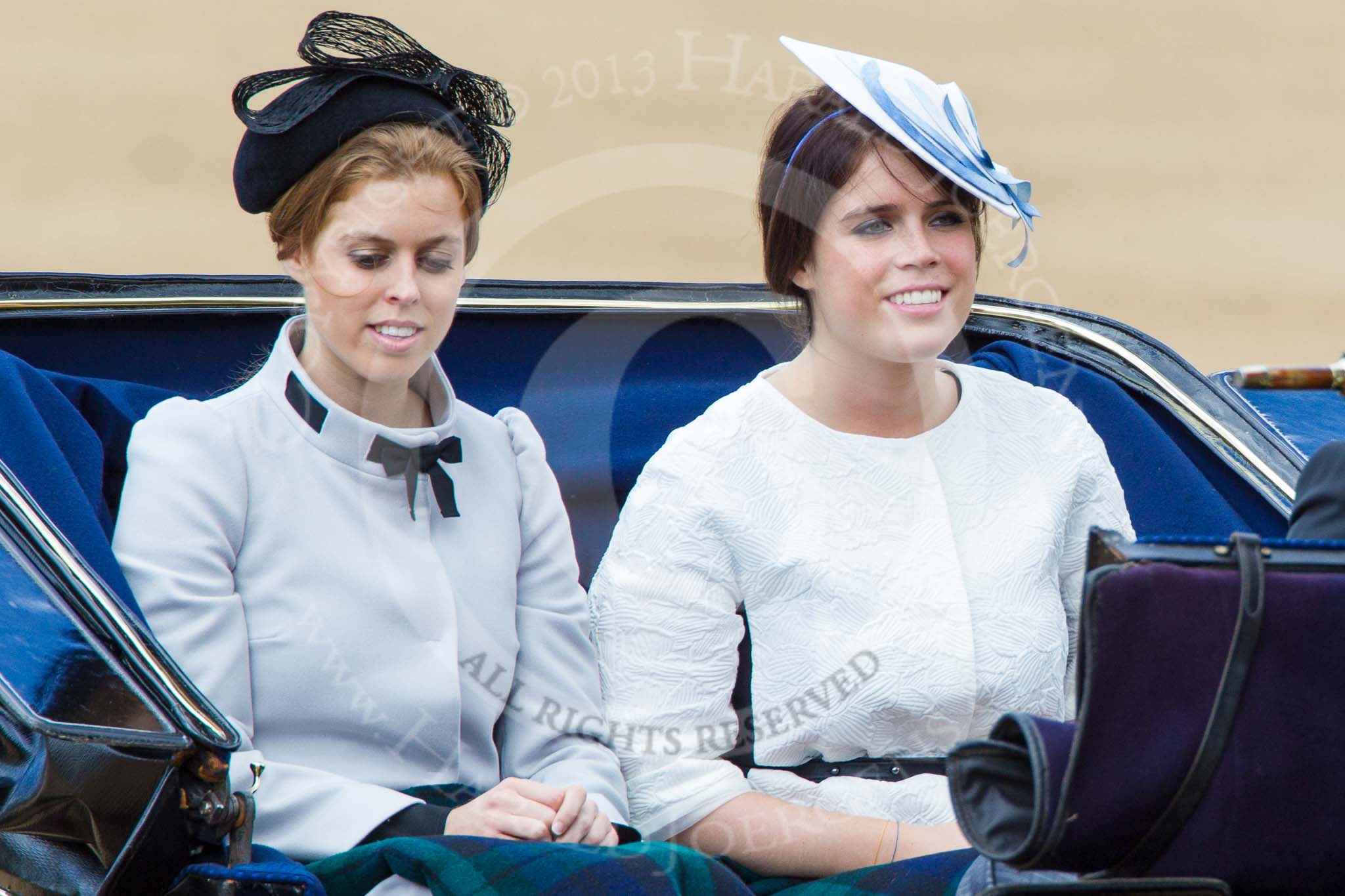 Trooping the Colour 2013: HRH Princess Beatrice of York and HRH Princess Eugenie of York in the second barouche carriage on the way across Horse Guards Parade to watch the parade from the Major General's office..
Horse Guards Parade, Westminster,
London SW1,

United Kingdom,
on 15 June 2013 at 10:50, image #209