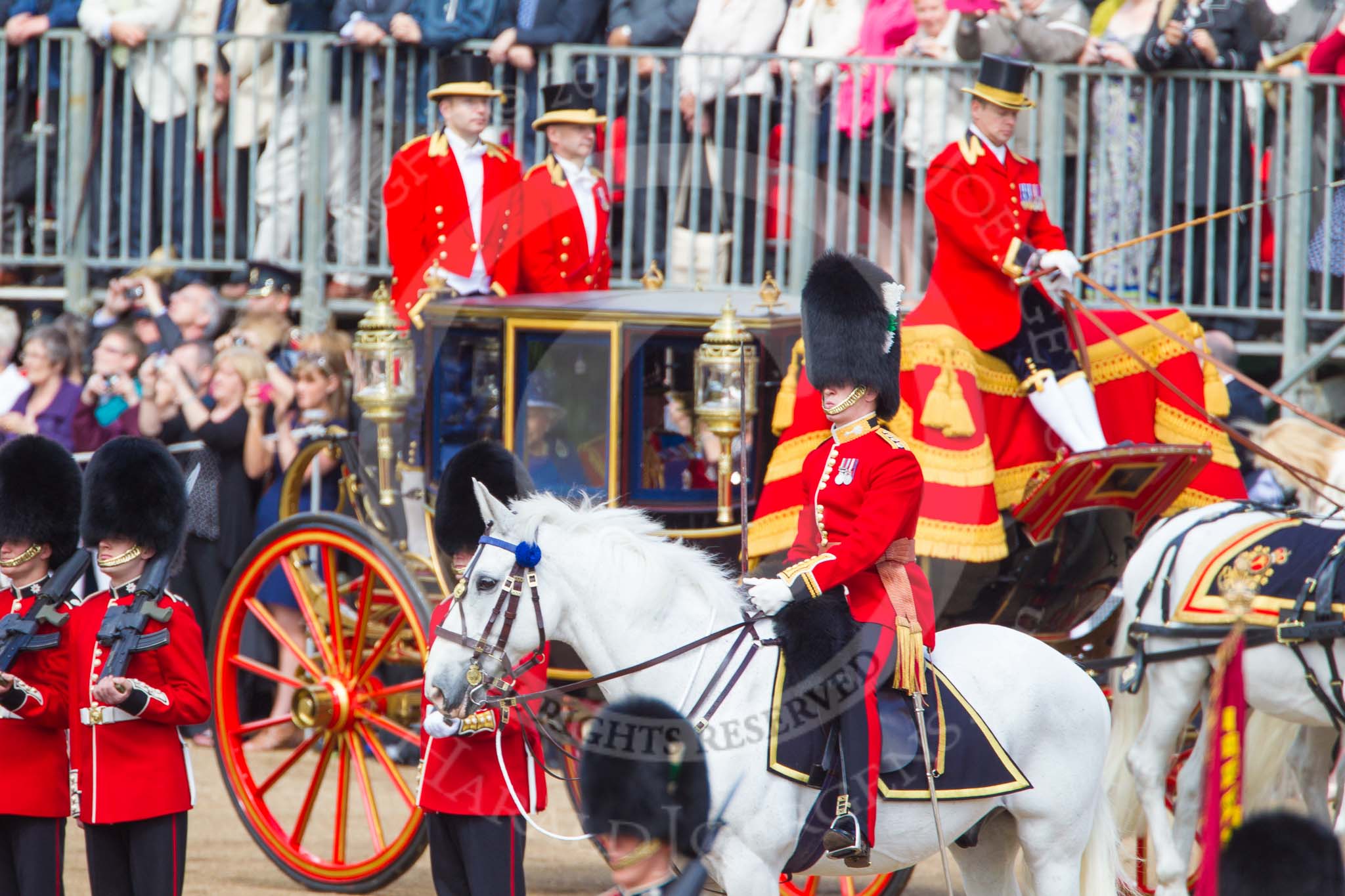 Trooping the Colour 2013: The Adjutant of the Parade, Captain C J P Davies, Welsh Guards, as HM The Queen passes him in the Glass Coach. Bottom right the Colour that will later be trooped can just be seen. Image #262, 15 June 2013 10:58 Horse Guards Parade, London, UK