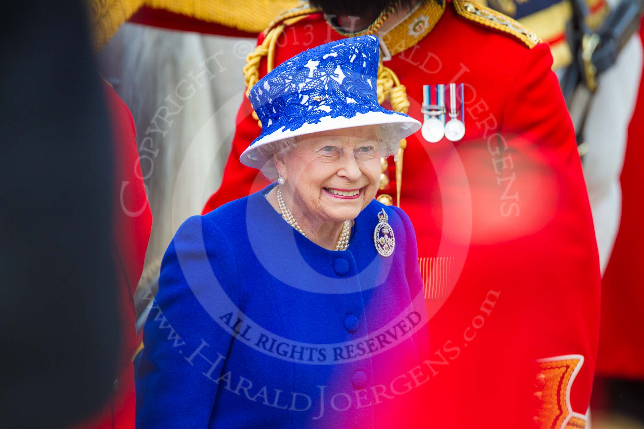 Trooping the Colour 2013: HM The Queen, smiling, on the way from the Glass Coach to the dais..
Horse Guards Parade, Westminster,
London SW1,

United Kingdom,
on 15 June 2013 at 11:08, image #383