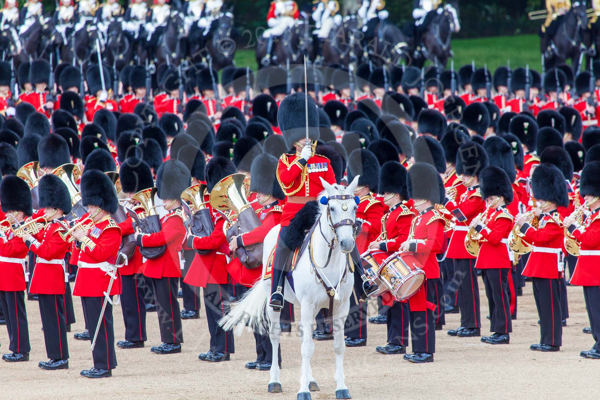 Trooping the Colour 2013: The Field Officer in Brigade Waiting, Lieutenant Colonel Dino Bossi, Welsh Guards, commanding "present arms" as the Escort to the Colour is starting the trooping of the Colour through the ranks. Image #487, 15 June 2013 11:24 Horse Guards Parade, London, UK