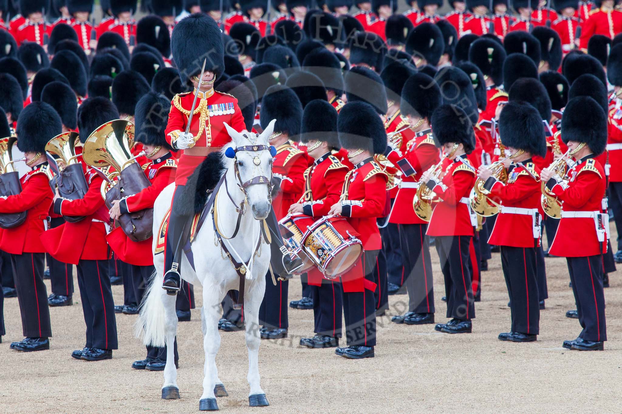 Trooping the Colour 2013: The Field Officer in Brigade Waiting, Lieutenant Colonel Dino Bossi, Welsh Guards, commanding "present arms" as the Escort to the Colour is starting the trooping of the Colour through the ranks. Image #488, 15 June 2013 11:24 Horse Guards Parade, London, UK