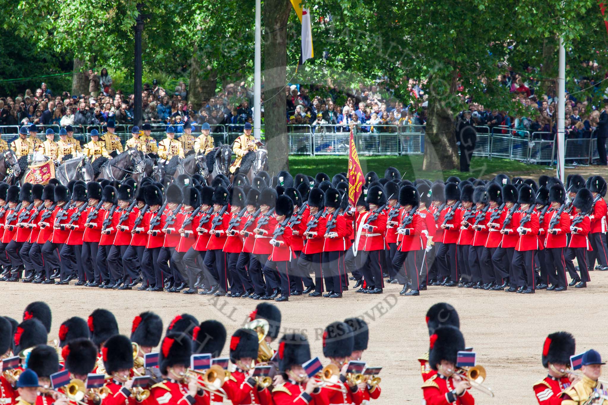 Trooping the Colour 2013: The March Past in Quick Time. No. 1 Guard, the Escort to the Colour,1st Battalion Welsh Guards,  marching along the Mounted Bands of the Household Cavalry. Image #617, 15 June 2013 11:48 Horse Guards Parade, London, UK