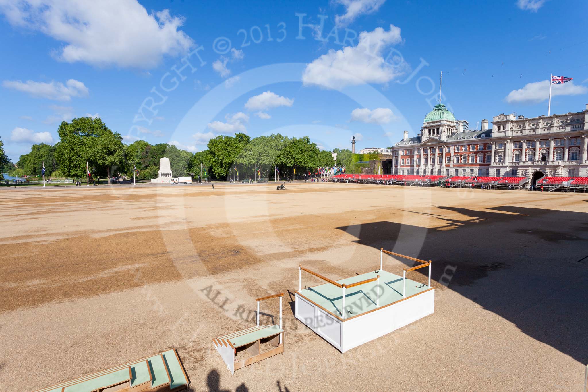 Horse Guards Parade in the morning of a beautiful day. On the bottom of the photo are the three parts of the dais that will be put together later.