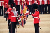 Duty Drummer  Sam Orchard saluting the uncased Colour held by Colour Sergeant Sam McAuley (31), with Colour Sentry Guardsman Jonathon Hughes (26) behind, during The Colonel's Review 2018 (final rehearsal for Trooping the Colour, The Queen's Birthday Parade)  at Horse Guards Parade, Westminster, London, 2 June 2018, 10:33.