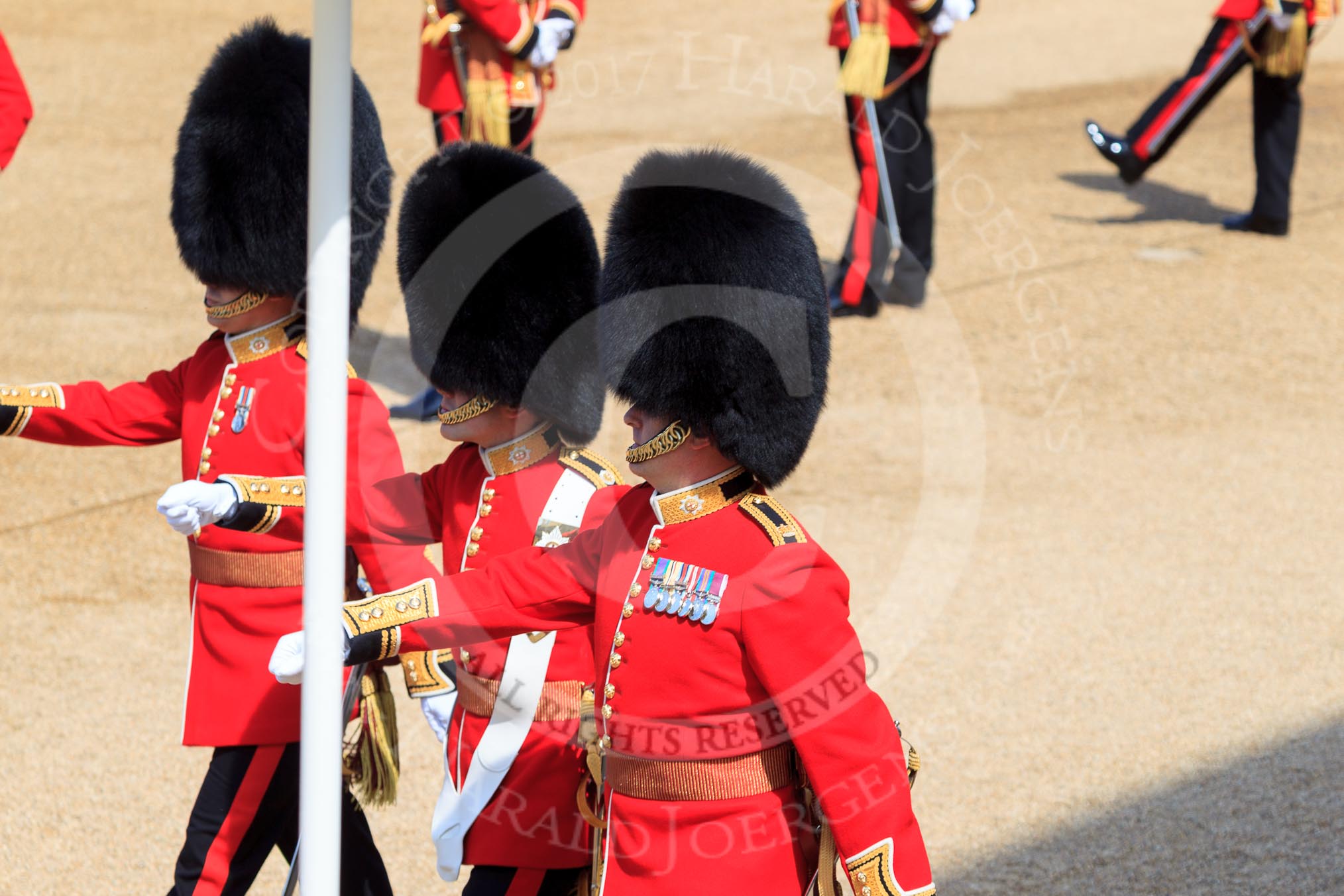 The Subaltern, Captain HCC Bucknall, The Ensign, 2nd Lieutenant J Boggis-Rolfe, and The Captain of the Guard, Major JW Coleby, all Escort to the Colour, 1st Battalion Coldstream Guards, marching from Horse Guards Arch to their guard during Trooping the Colour 2018, The Queen's Birthday Parade at Horse Guards Parade, Westminster, London, 9 June 2018, 10:37.