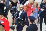 BBC Steadycam operator arrives at Horse Guards Parade, finding a way through the crowds before during Trooping the Colour 2018, The Queen's Birthday Parade at Horse Guards Parade, Westminster, London, 9 June 2018, 09:36.