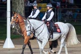 Two female Metropolitan Police officers on horseback, riding past the Youth Enclosure, before Trooping the Colour 2018, The Queen's Birthday Parade at Horse Guards Parade, Westminster, London, 9 June 2018, 09:47.