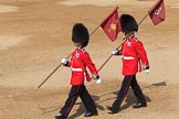 Two markers from Number Six Guard, F Company, Scots Guards marching with their flags to mark the position of their guard on arrival at Horse Guards Parade before Trooping the Colour 2018, The Queen's Birthday Parade at Horse Guards Parade, Westminster, London, 9 June 2018, 10:17.