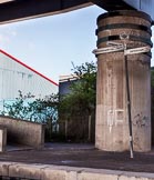 BCN Marathon Challenge 2013: The BCNS signpost at  Oldbury Junction, next to a massive concrete pylon carrying the M5 motorway on the BCN Old Main Line..
Birmingham Canal Navigation,


United Kingdom,
on 25 May 2013 at 10:04, image #137