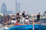 TOW River Thames Barge Driving Race 2013: Rowers on the deck of of barge "Darren Lacey", by Princess Pocahontas, during the race. In the background the skyscrapers of the City of London, including the "Gherkin"..
River Thames between Greenwich and Westminster,
London,

United Kingdom,
on 13 July 2013 at 12:42, image #179