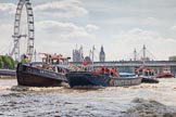 TOW River Thames Barge Driving Race 2013: Tug "Swiftstone" pullig barge "Diana", by Trinity Buoy Wharf, back to Greenwich. In the backround the London Eye, Westminster Bridge, and Big Ben..
River Thames between Greenwich and Westminster,
London,

United Kingdom,
on 13 July 2013 at 14:47, image #526