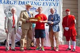 TOW River Thames Barge Driving Race 2013: The "Steven Bennet Memorial Trophy", presented to the apprentice on the winning barge, goes to M. O'Doherty of barge  "Blackwall", by the Port of London Authority..
River Thames between Greenwich and Westminster,
London,

United Kingdom,
on 13 July 2013 at 16:28, image #578