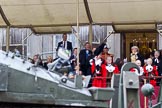 The Lord Mayor's Show 2011: The new Lord Mayor, David Wootton, waiving his tricorne hat on the balcony of Mansion House, as an armored personal carrier from 151 (London) Transport Regiment (V) passes by..
Opposite Mansion House, City of London,
London,
-,
United Kingdom,
on 12 November 2011 at 11:30, image #313