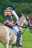 7th Heritage Polo Cup semi-finals: Leigh Fisher fixing her stirrup for the next chukker - Ladies of the British Empire, Liberty Freedom..
Hurtwood Park Polo Club,
Ewhurst Green,
Surrey,
United Kingdom,
on 04 August 2012 at 13:22, image #133